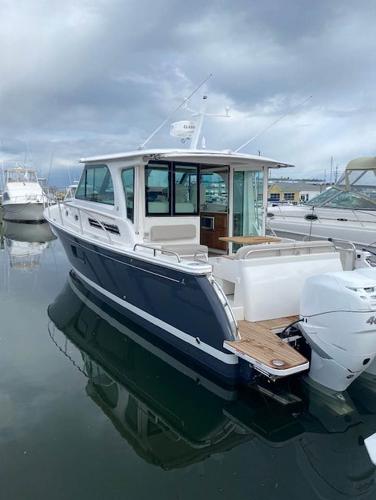2025 Back Cove 39O boat docked in a marina.