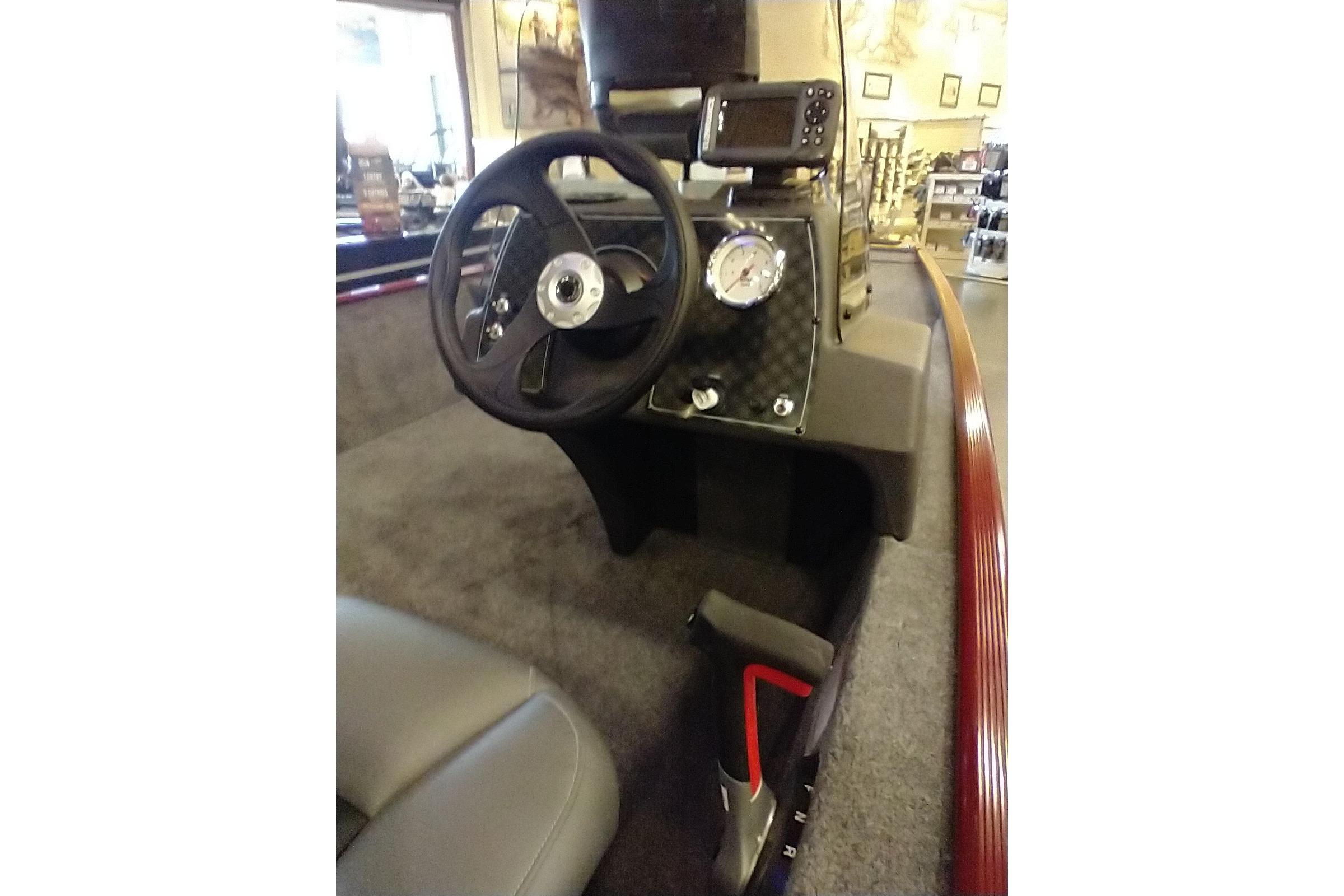 2026 Tracker Bass Tracker Classic XL boat dashboard with steering wheel and gauge.