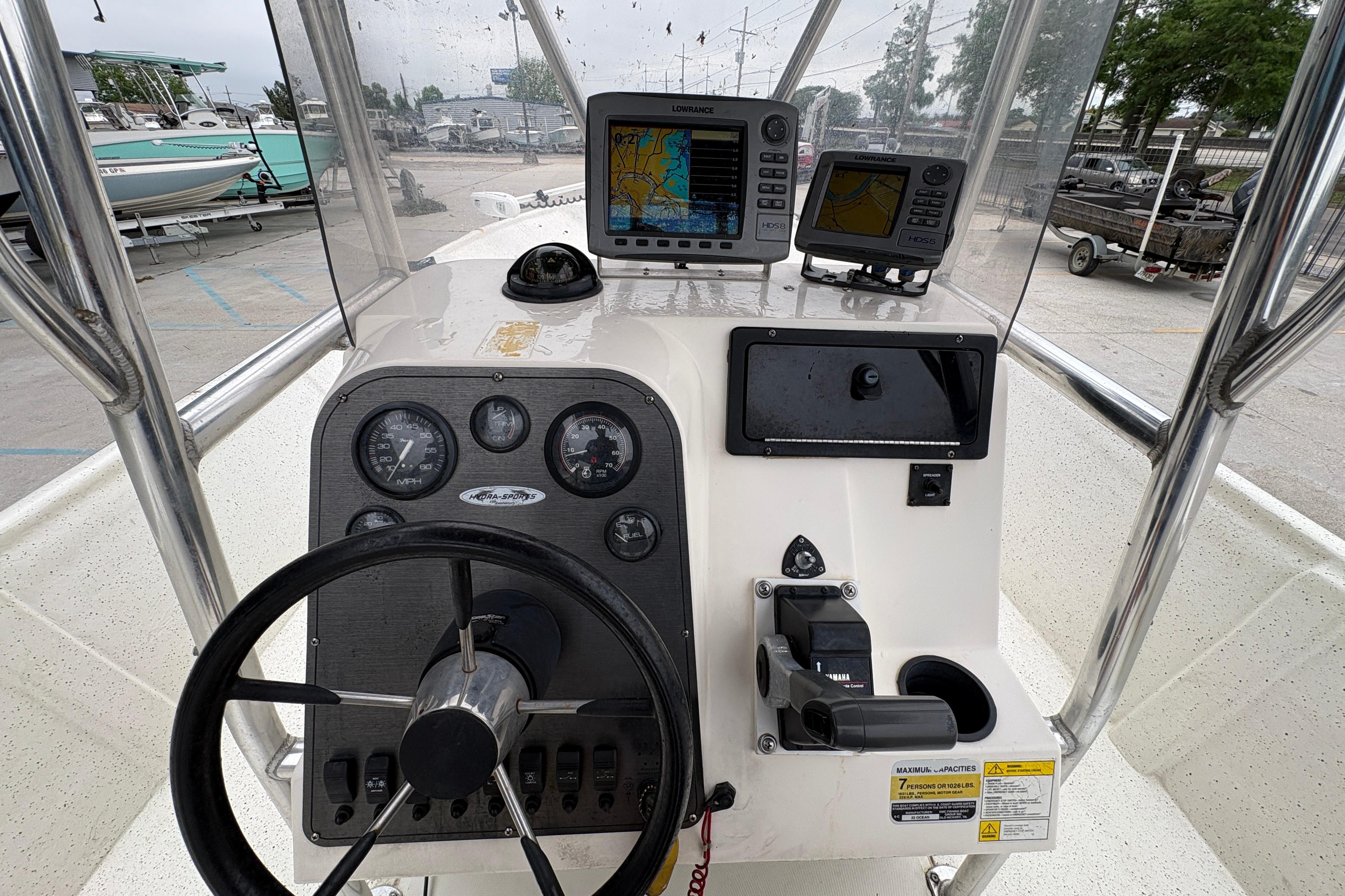 1998 Hydra-Sports 22 Ocean CC boat dashboard with navigation equipment and steering wheel.