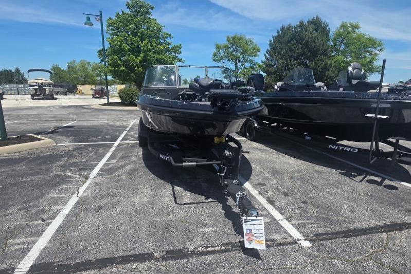 2026 Nitro ZV20 Pro boat on trailer in parking lot under clear sky.