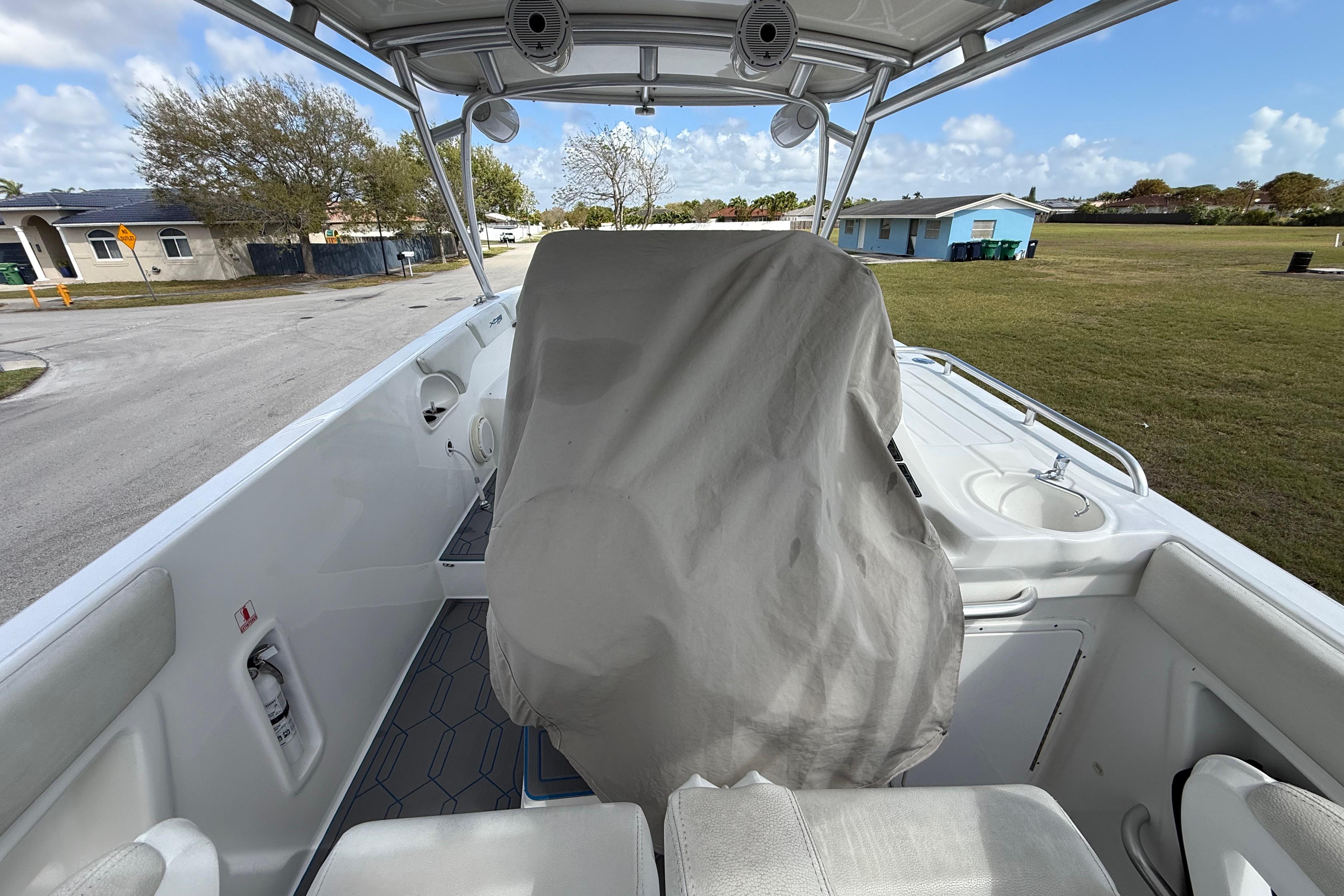 2016 Extreme Boats XC 38 Express interior with covered helm, outdoor setting.