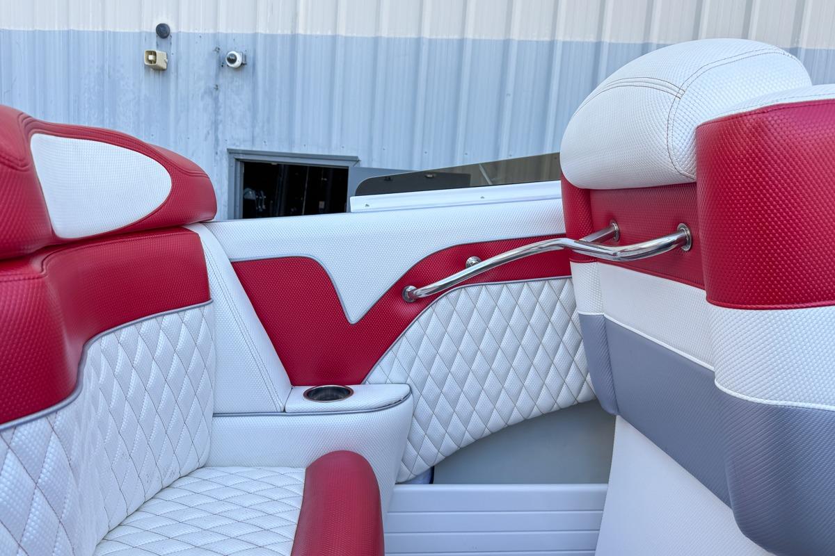 Red and white interior of 2022 Velocity 290sc boat with quilted seats.