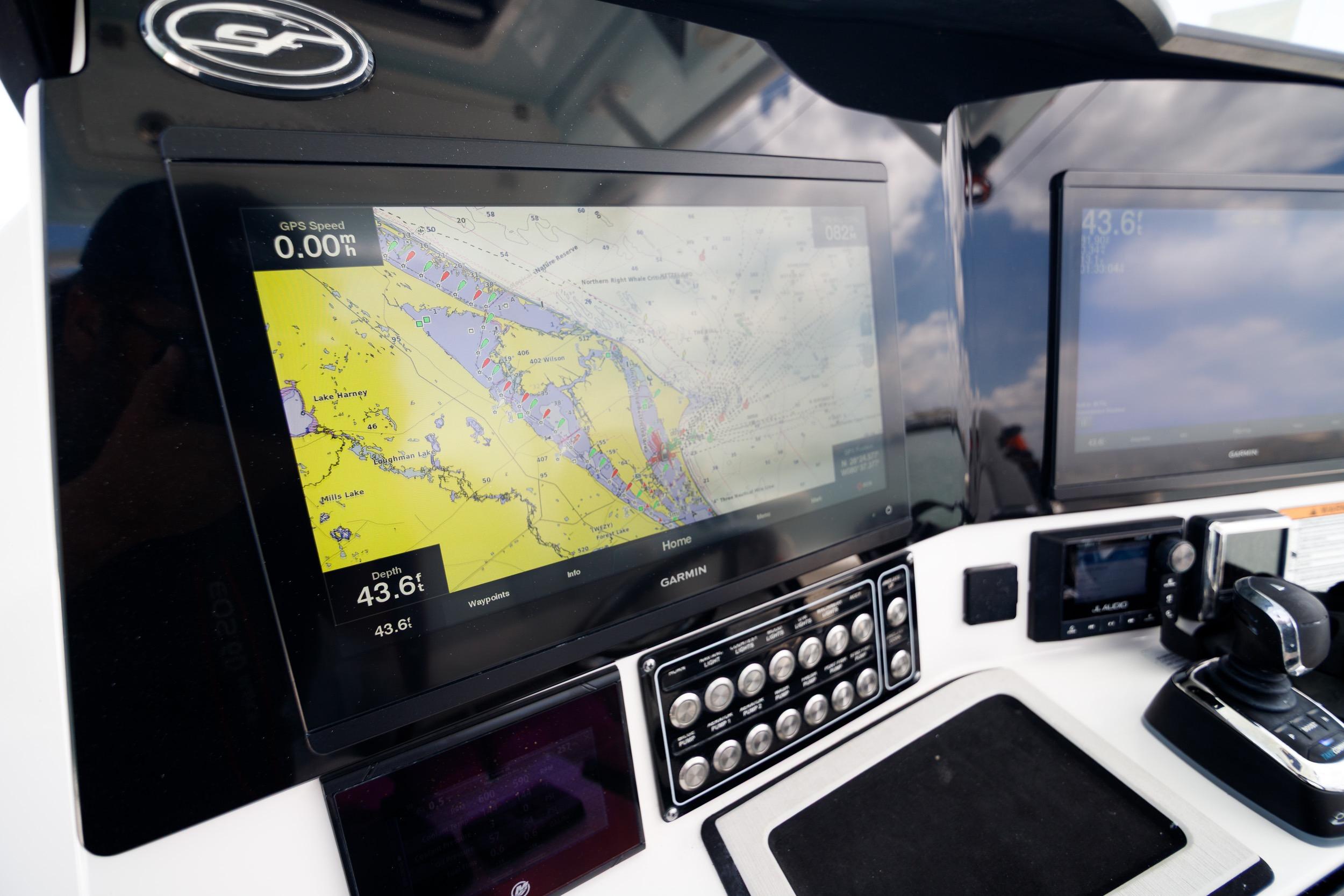 Dashboard of 2021 Sea Fox 328 Commander with navigation screens and controls.