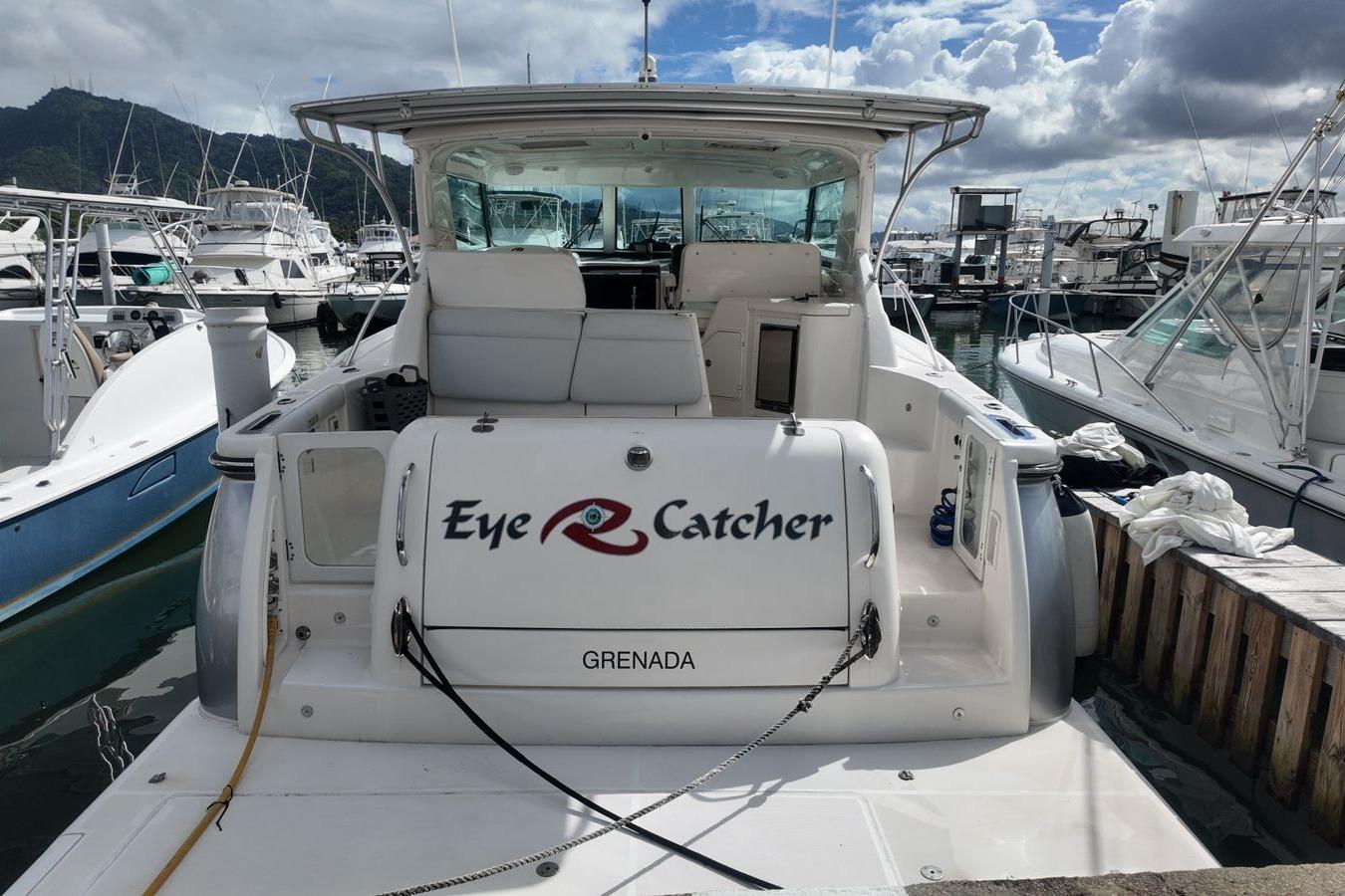 2004 Tiara Yachts 4400 Sovran docked, named "Eye Catcher," in a marina setting.