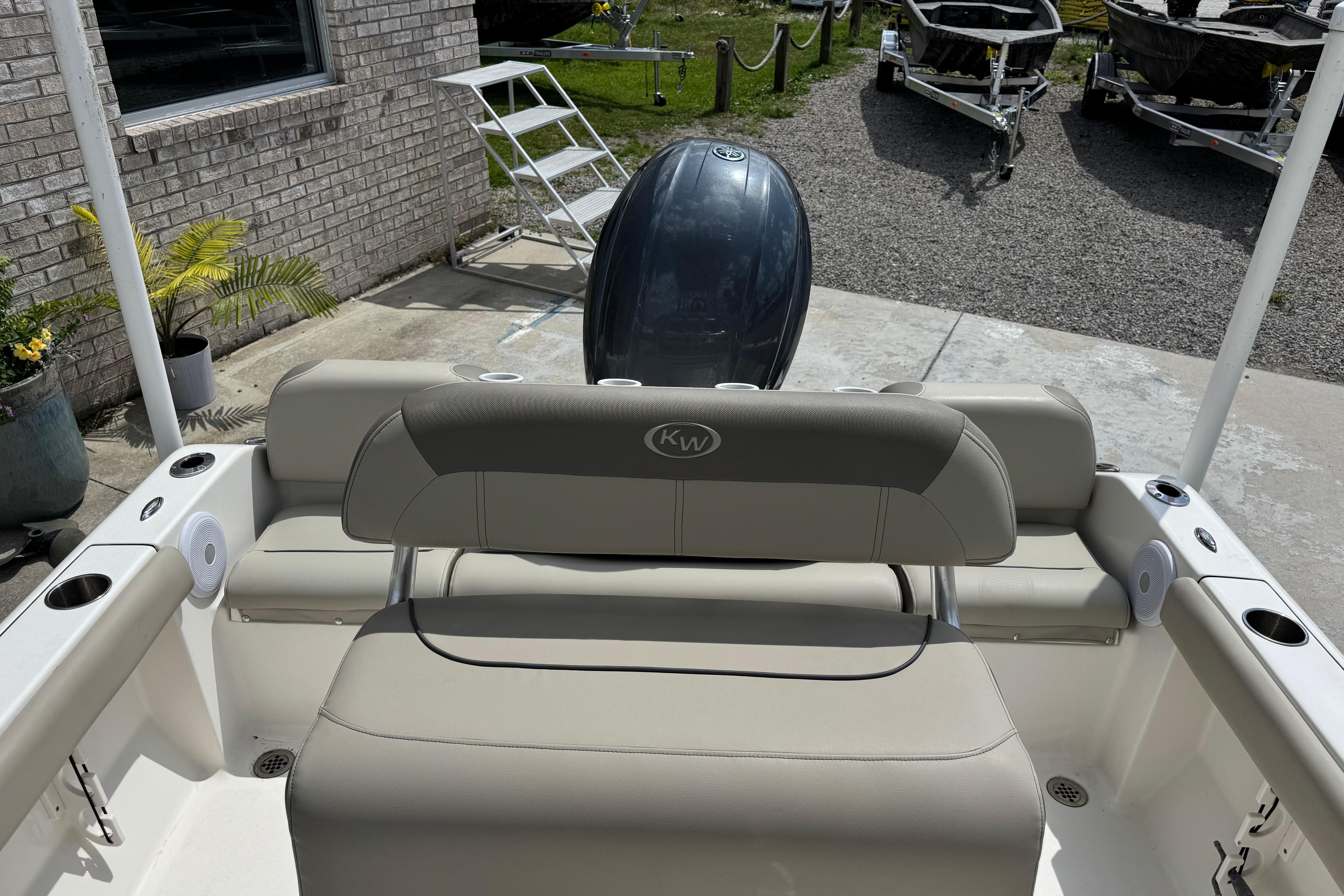2022 Key West 189 FS boat interior with seating and motor, displayed outdoors.