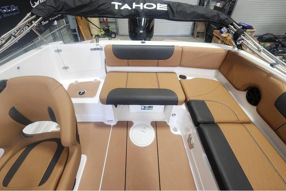2026 Tahoe 1950 boat interior with tan and black seating, showcasing modern design.