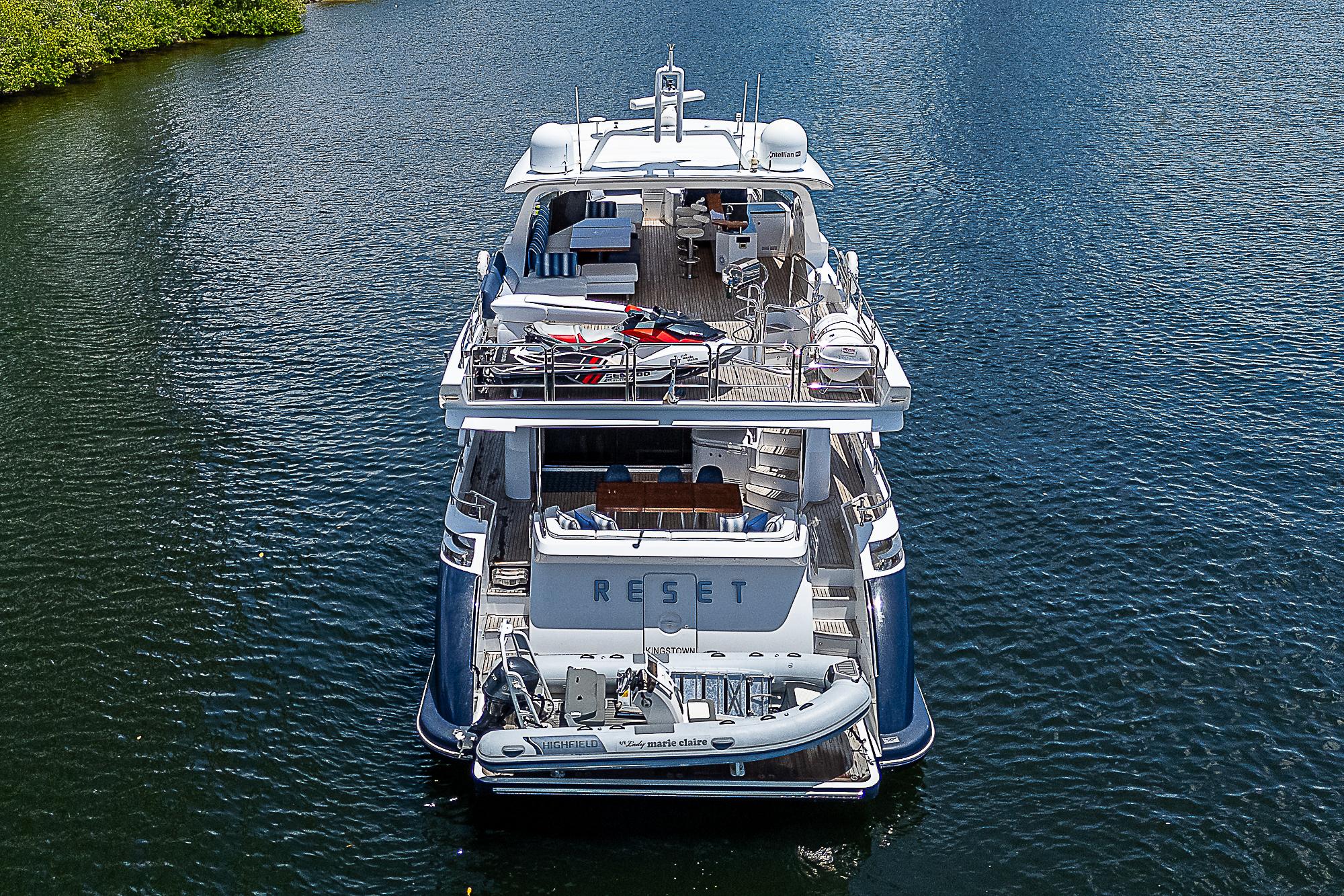 Luxurious 2011 Azimut 82 yacht on serene water, rear view.