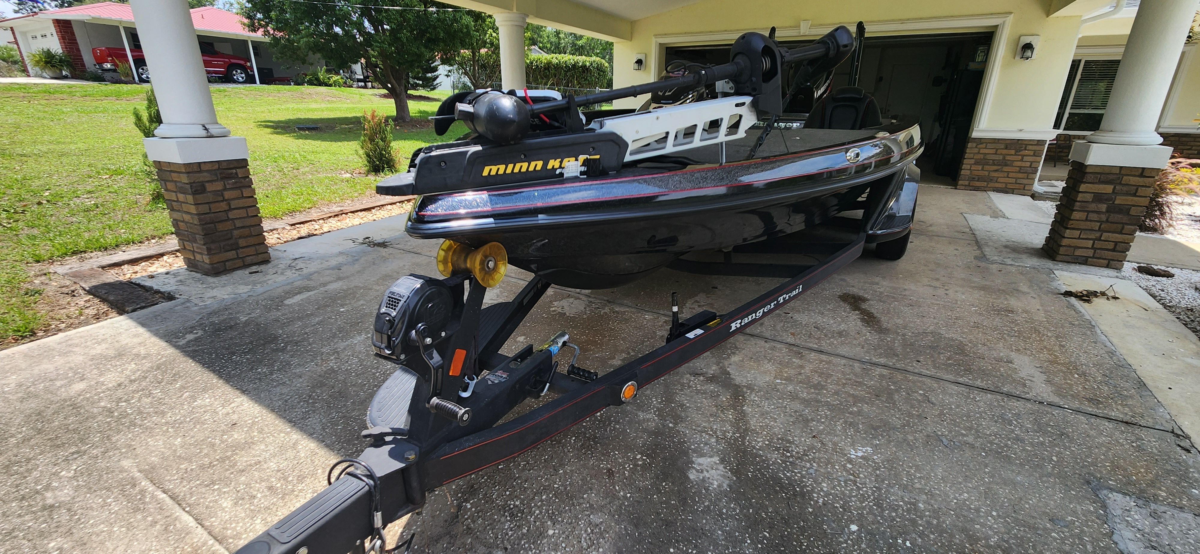 A 2017 Ranger Z520 Comanche on a trailer in a driveway.