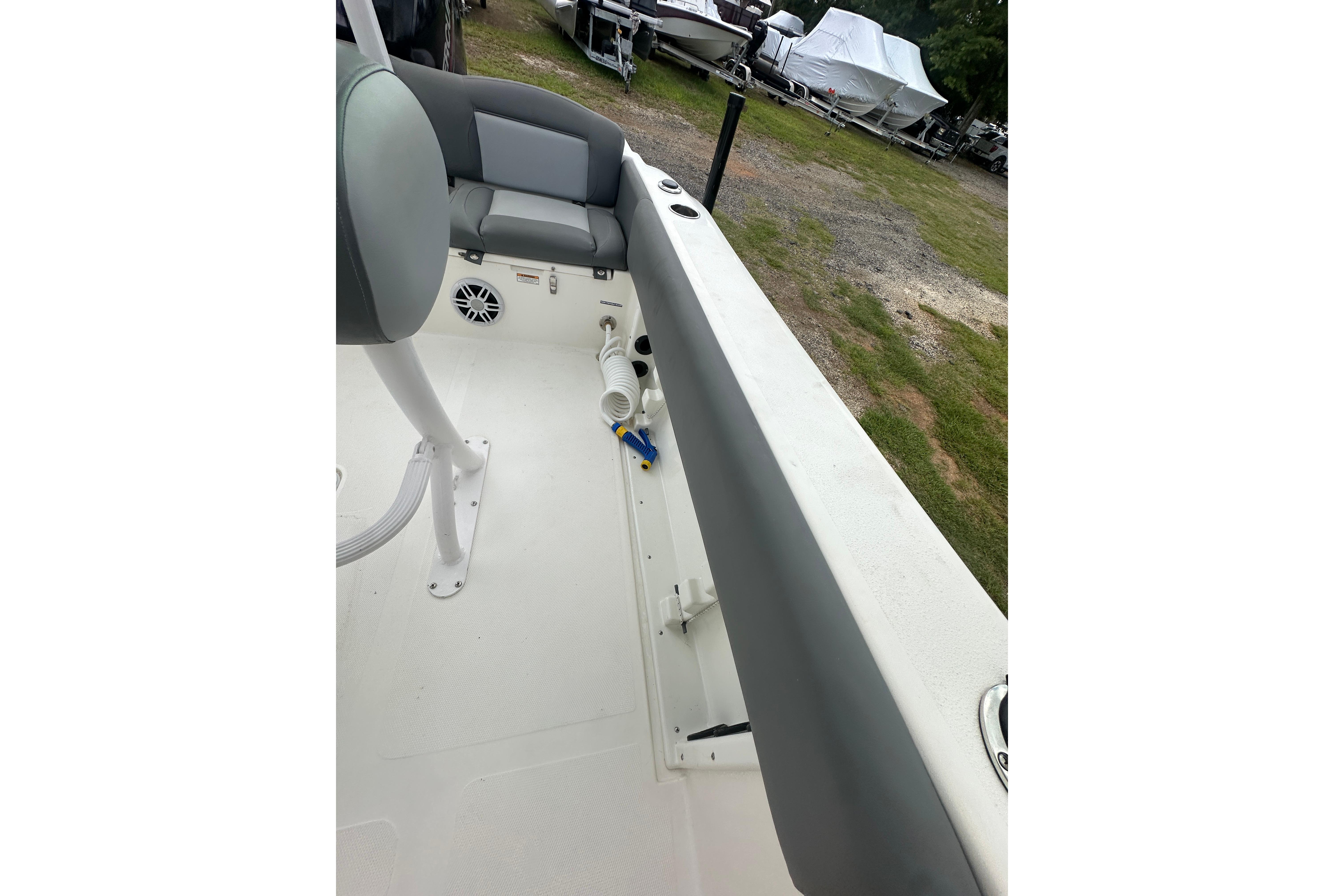 2023 NauticStar 2102 Legacy boat interior with seating and storage compartments.