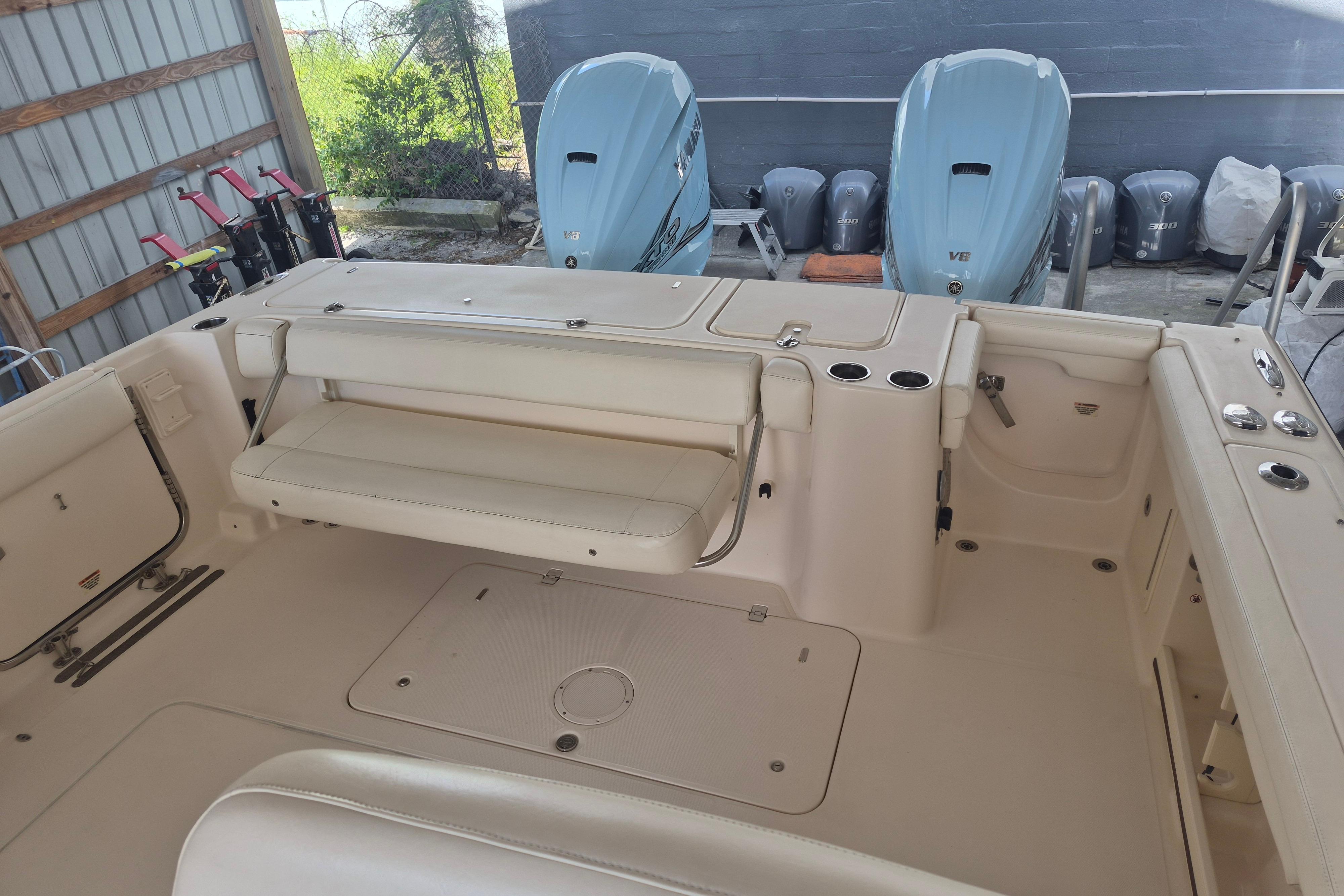 2019 Grady-White Freedom 335 boat interior with seating and twin outboard engines.