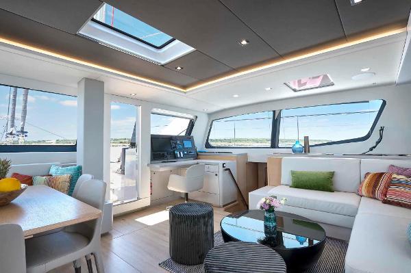 Luxurious interior of 2025 Privilege Signature 580 yacht with modern furnishings and panoramic windows.
