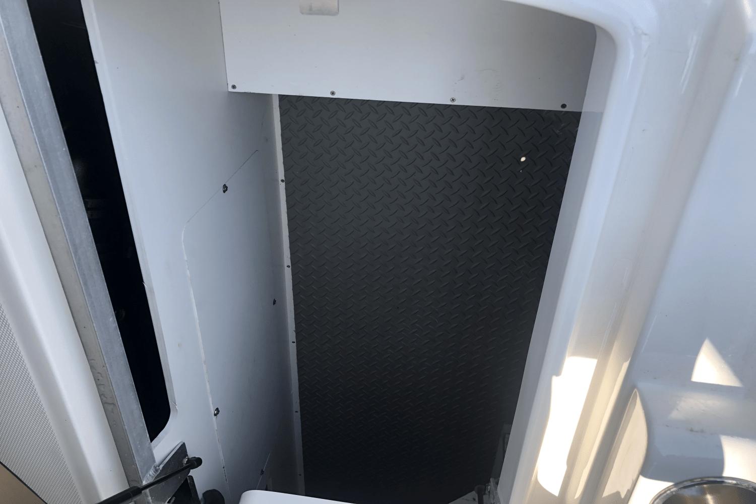 Interior view of 2017 Sea Ray SDX 270 boat, featuring a diamond-patterned wall.