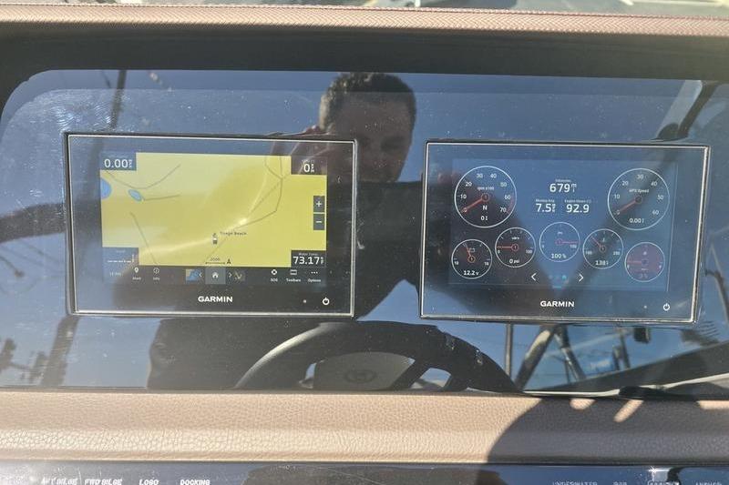 Dashboard of a 2022 Cobalt R4 boat with Garmin navigation displays.