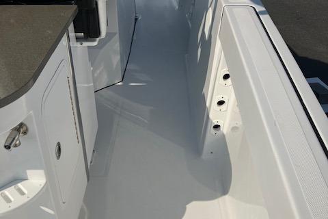 2025 Wellcraft 352 Fisherman boat interior, featuring sleek white deck and storage compartments.