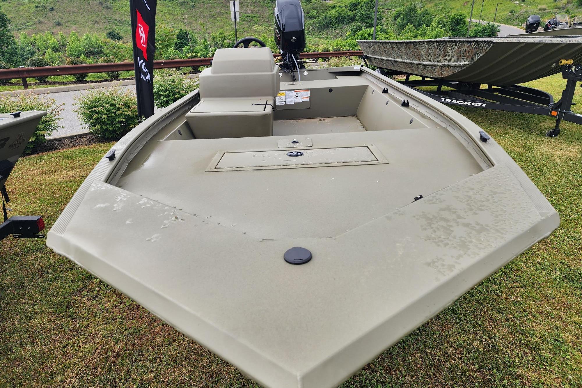 2026 Tracker Grizzly 1648 SC boat on display, featuring a spacious deck and sleek design.
