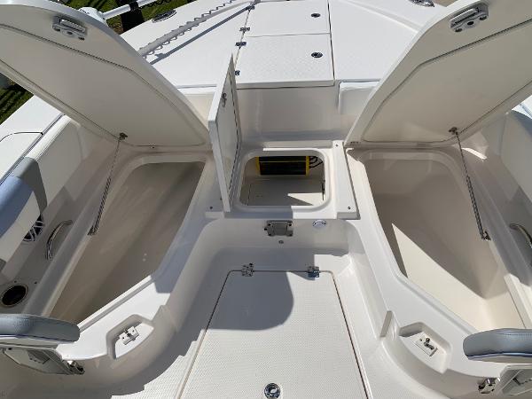 2024 Robalo 266 Cayman boat storage compartments open on deck.