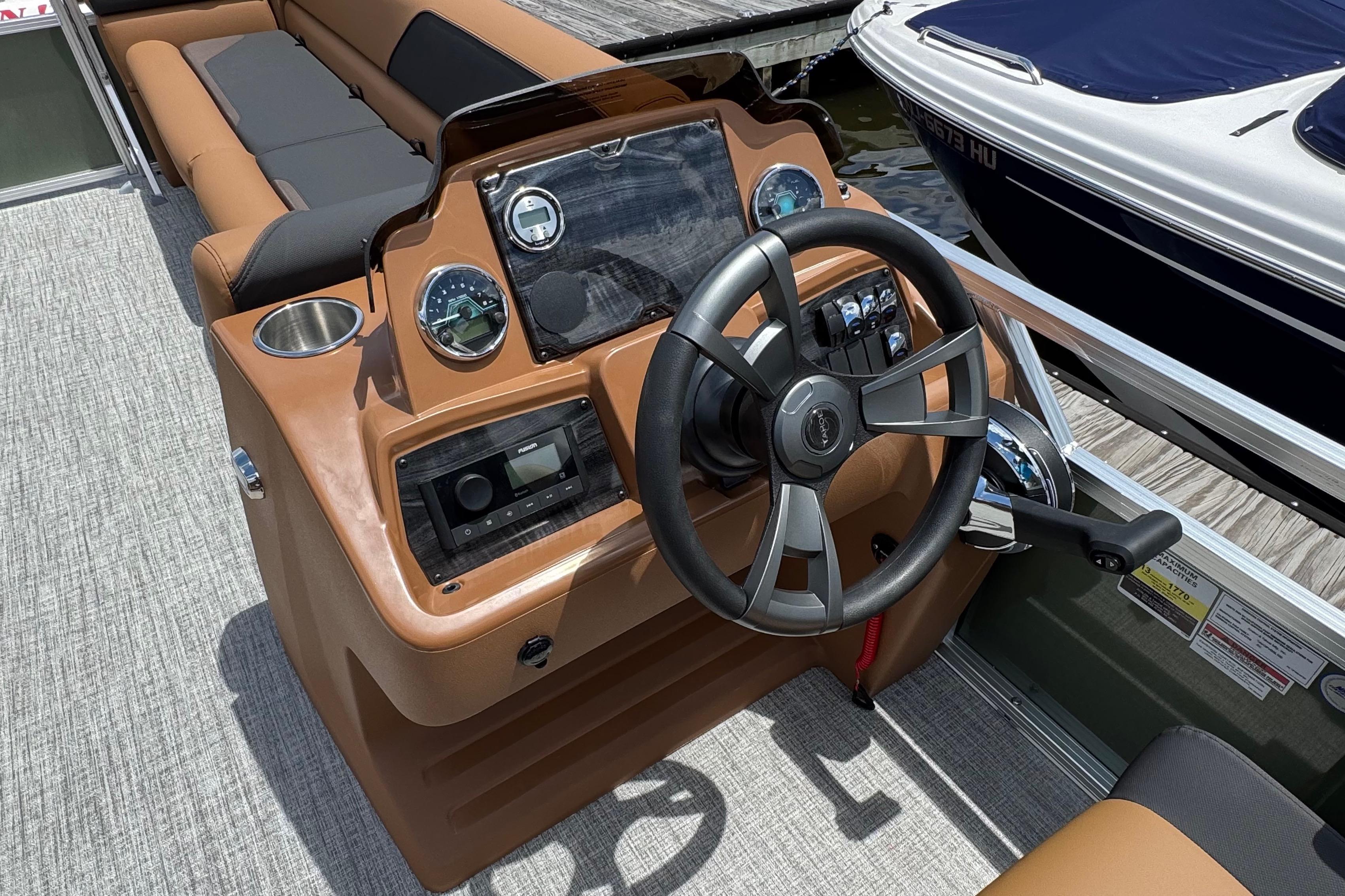 2026 Tahoe Pontoon Sport 85 Cruise Rear Bench 23 dashboard with steering wheel and controls.