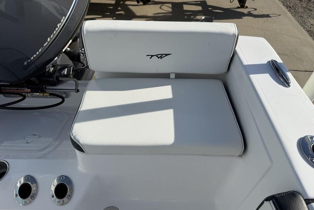 2026 Tidewater 198 CC Adventure boat seat with logo, featuring sleek white upholstery.