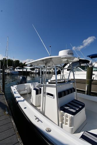 2021 Eastern 248 Center Console boat docked at a marina.