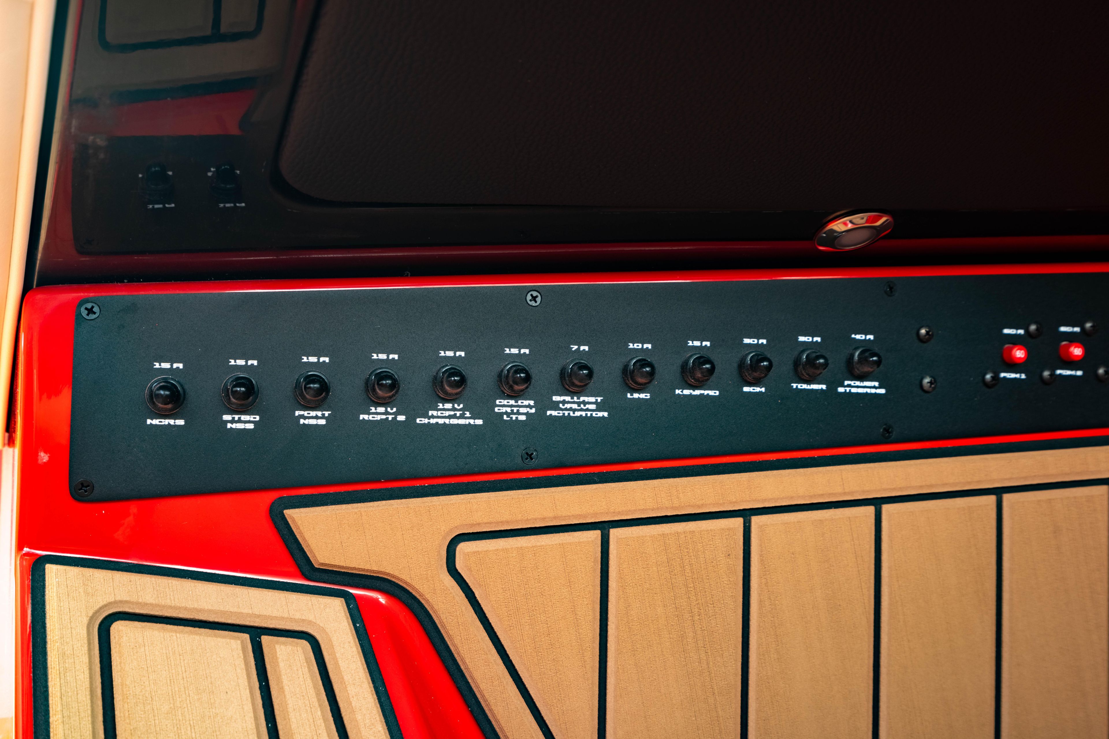 Control panel of 2025 Nautique Super Air Nautique GS20 boat, featuring various switches.
