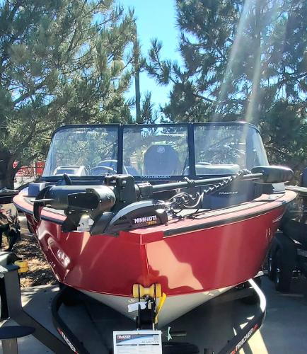 2024 Tracker Targa V-19 WT fishing boat with Minn Kota motor in outdoor setting.