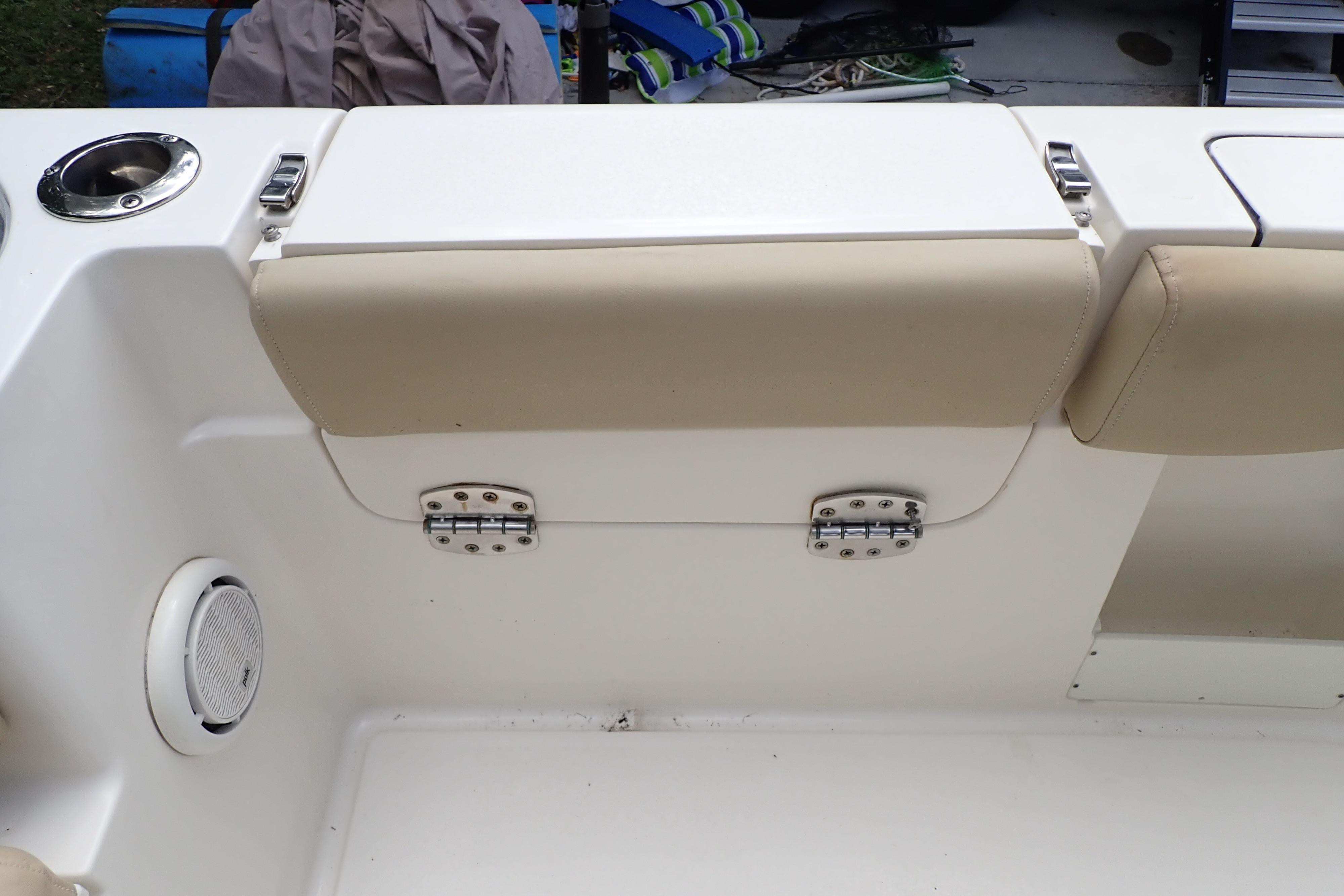 2019 Key West 263 FS boat interior with beige seating and stainless steel cup holder.