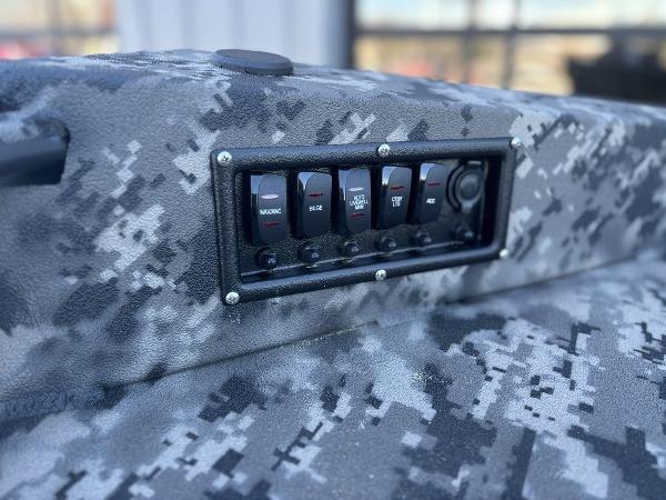 Control panel on 2025 Havoc 1656 VJST boat with camouflage design.