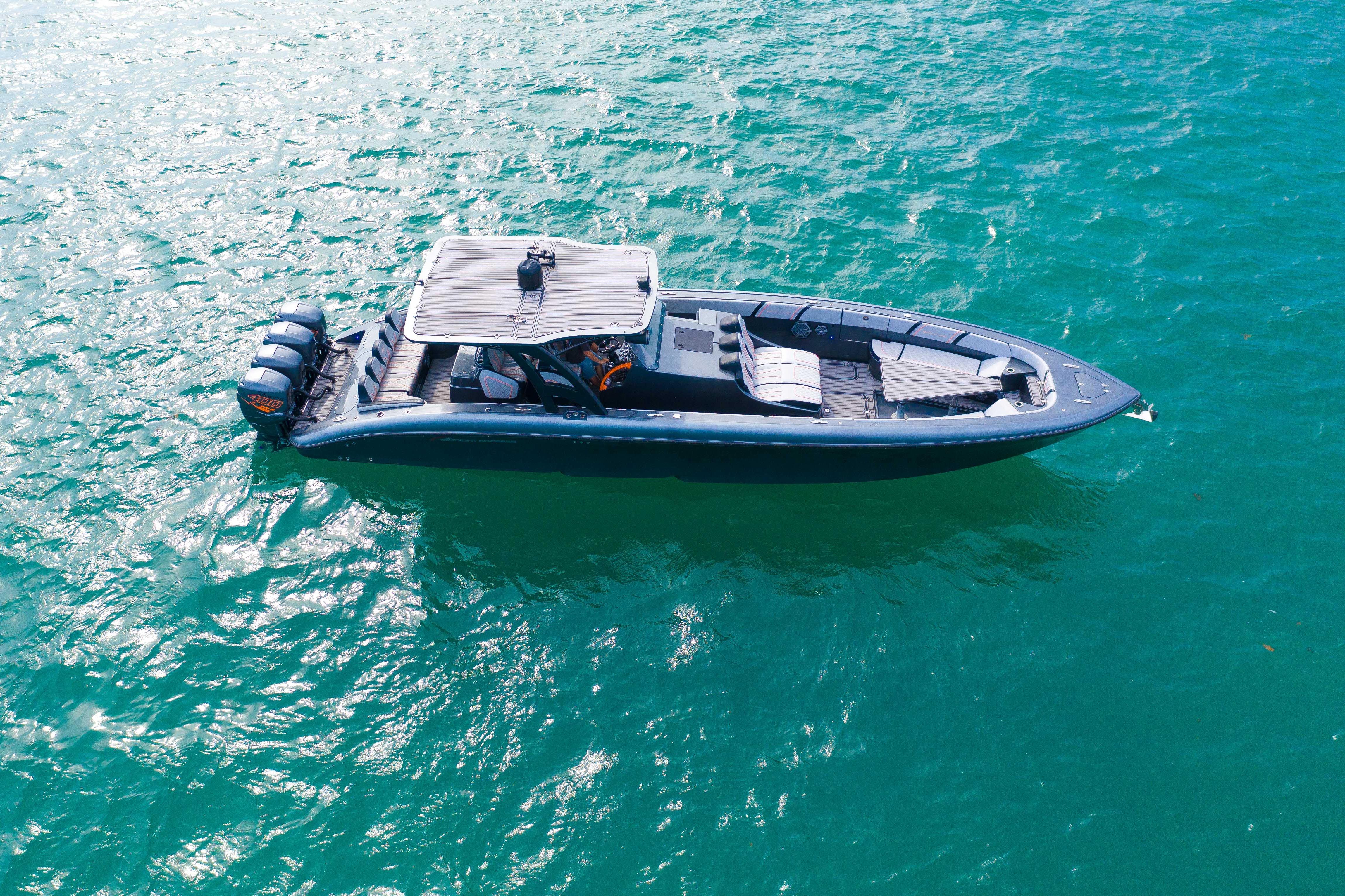 2019 Midnight Express 43 Open boat on turquoise water, aerial view.