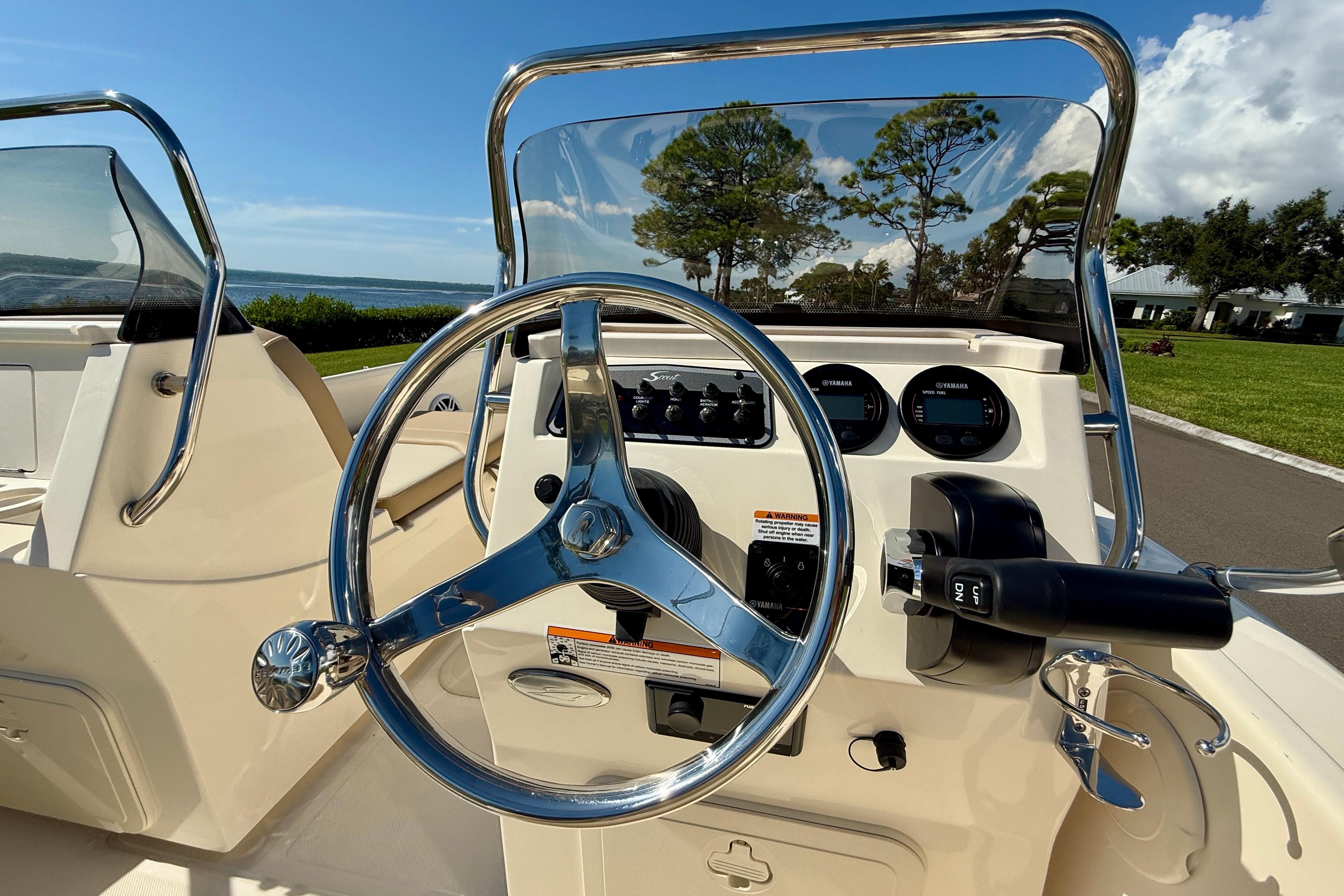 2026 Scout 175 Sport Dorado boat dashboard with steering wheel and controls.