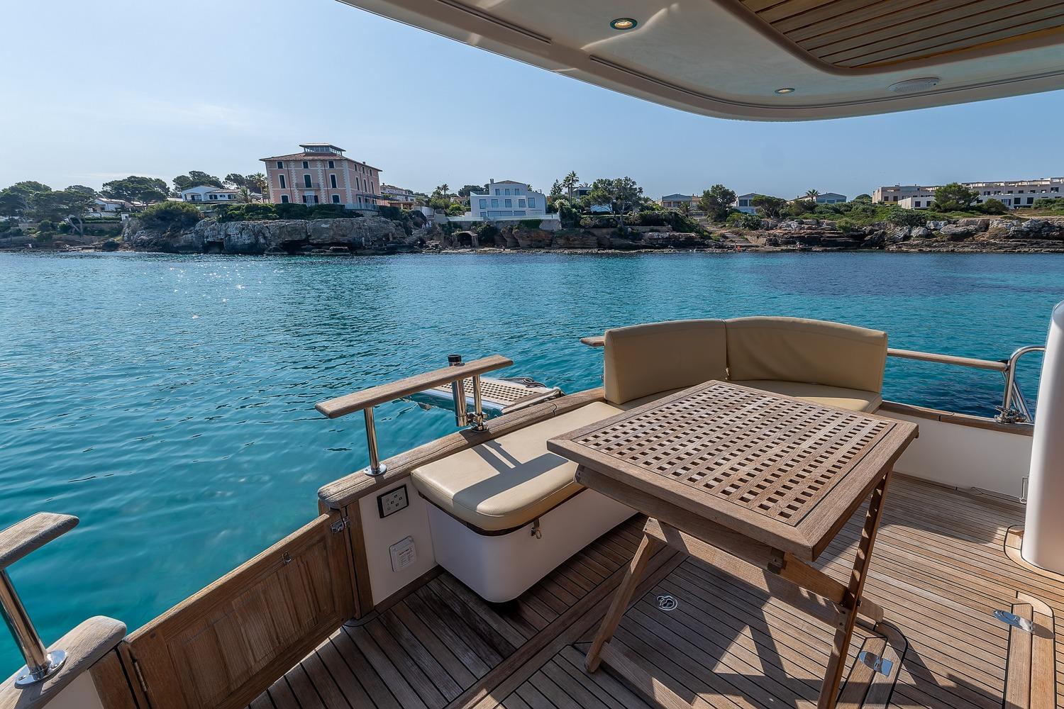 2018 Sasga Yachts Minorchino 34 deck with scenic coastal view.