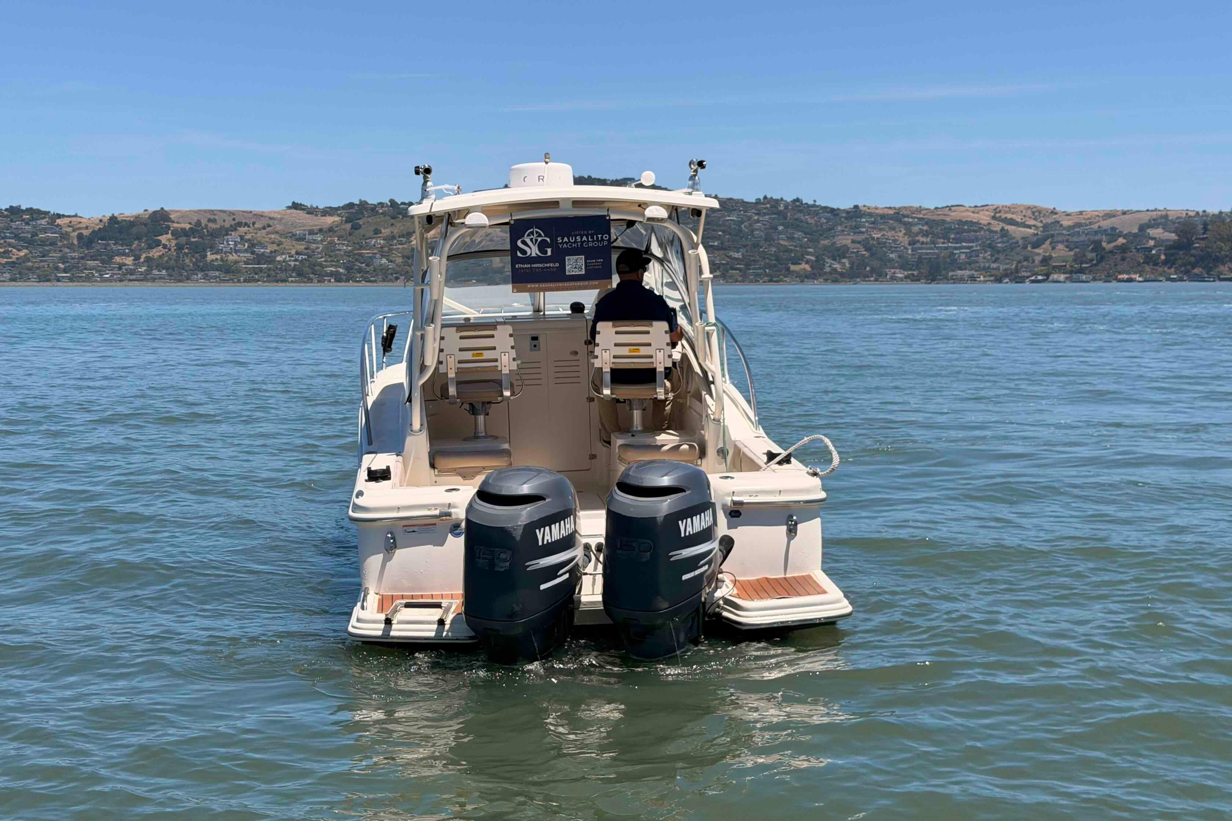 2007 Scout 262 Abaco boat with twin Yamaha engines on a calm lake.
