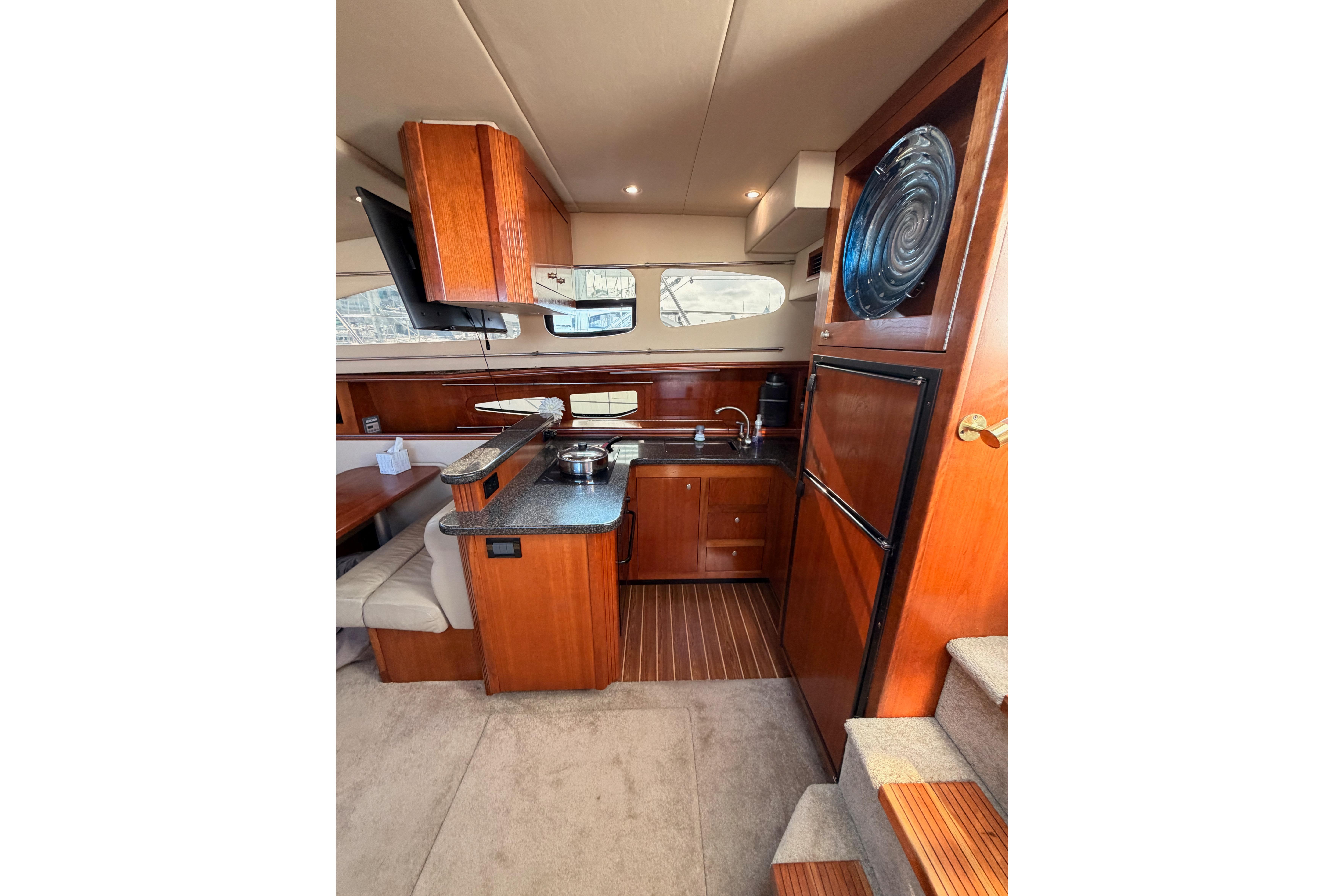 Luxurious 2005 Cruisers Yachts 405 Express Motoryacht interior with modern kitchen amenities.