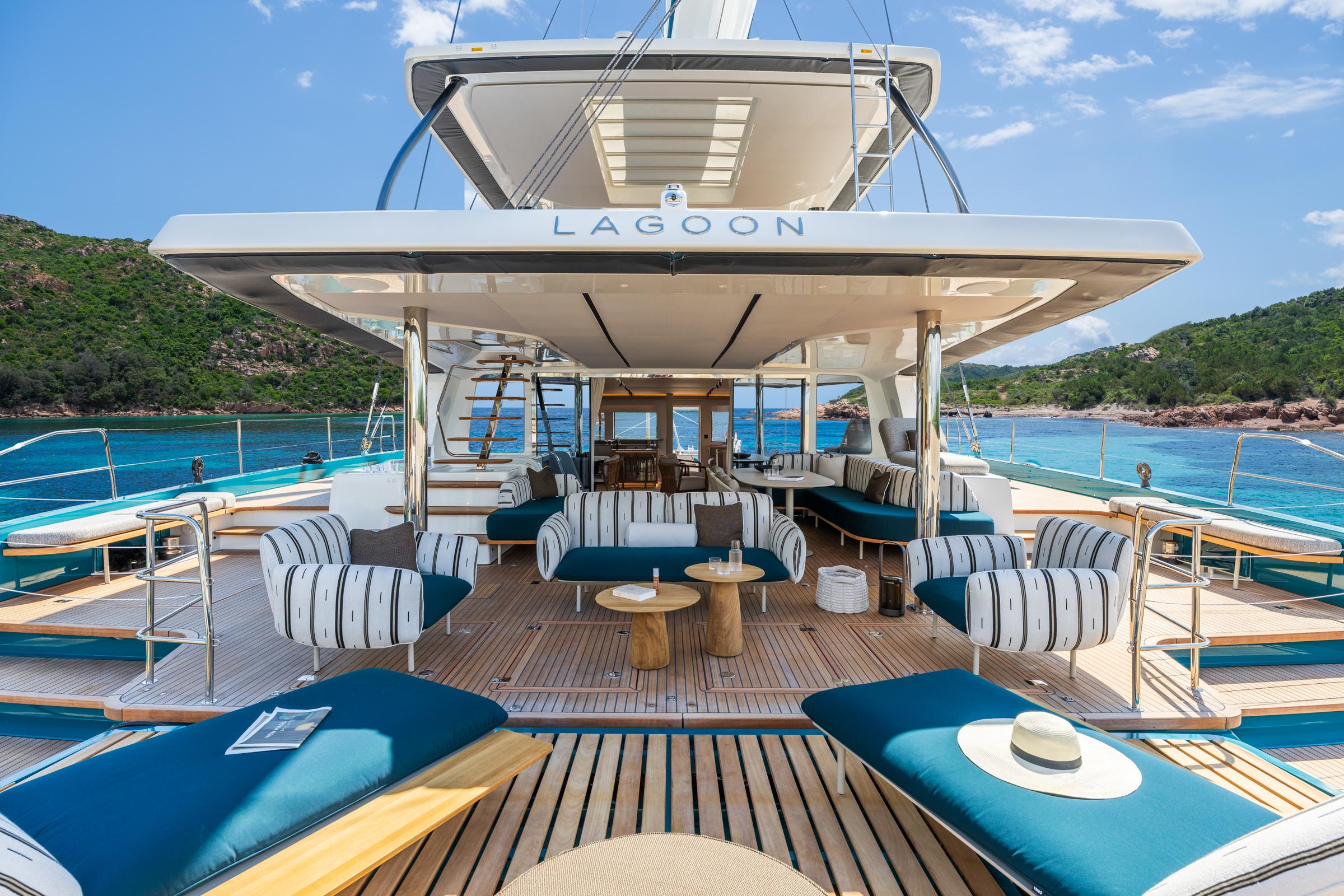 Luxurious 2025 Lagoon Eighty 2 yacht with elegant outdoor seating and scenic ocean view.