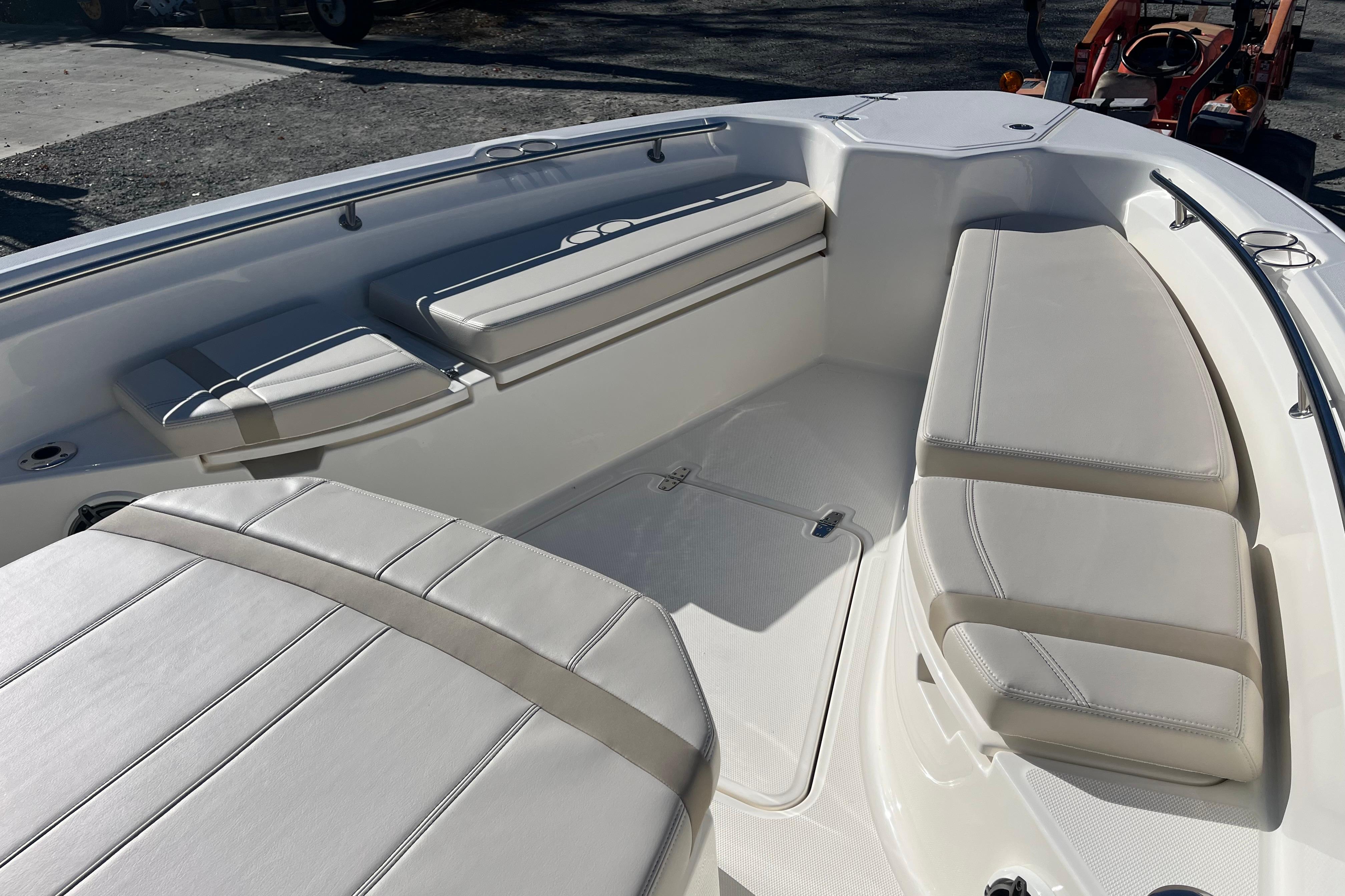 2026 Boston Whaler 280 Dauntless boat interior with cushioned seating and sleek design.