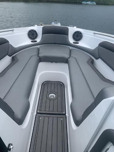 2020 Rinker 29QX BR boat with spacious seating and modern design.