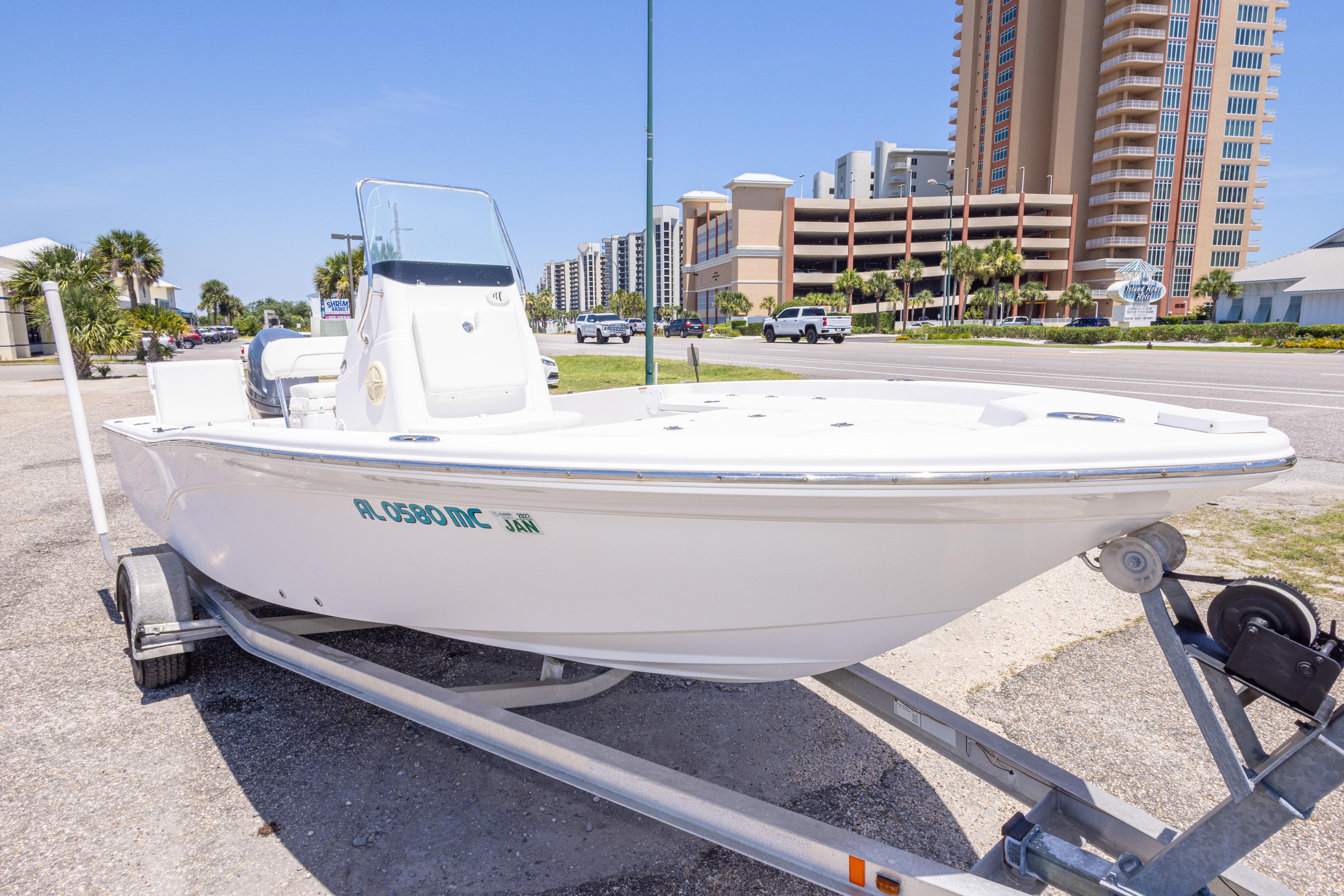 2011 Sea Fox 200XT boat on trailer, urban background, clear sky.