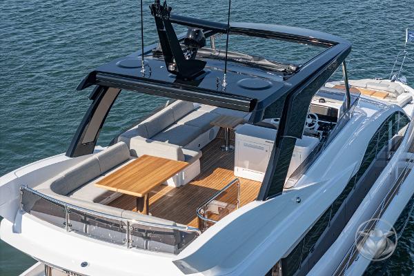 Luxurious 2025 Sunseeker Manhattan 68 yacht with spacious deck and modern seating area.