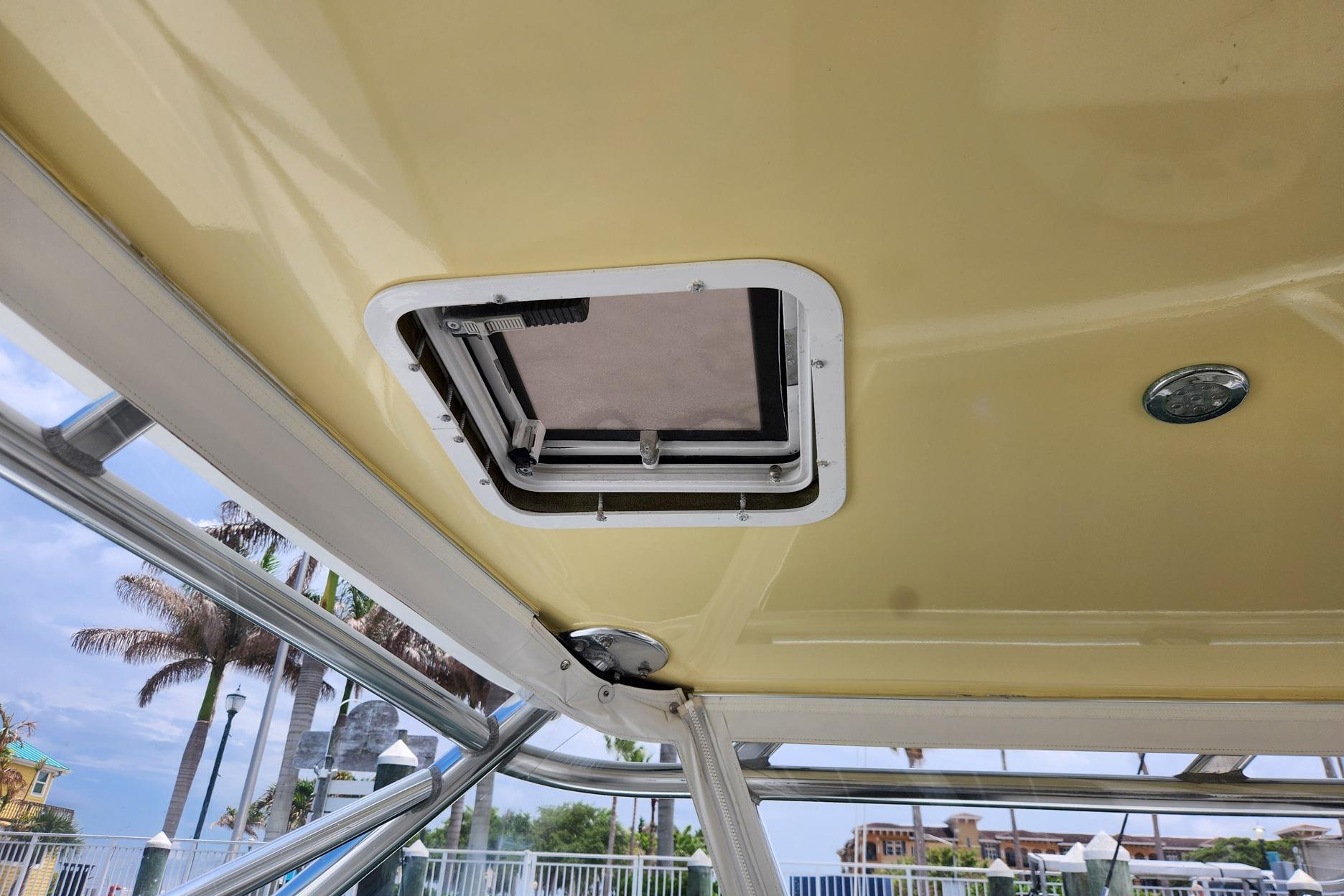 1987 Young Brothers Custom Sport Fish boat interior with hatch and metal frame.