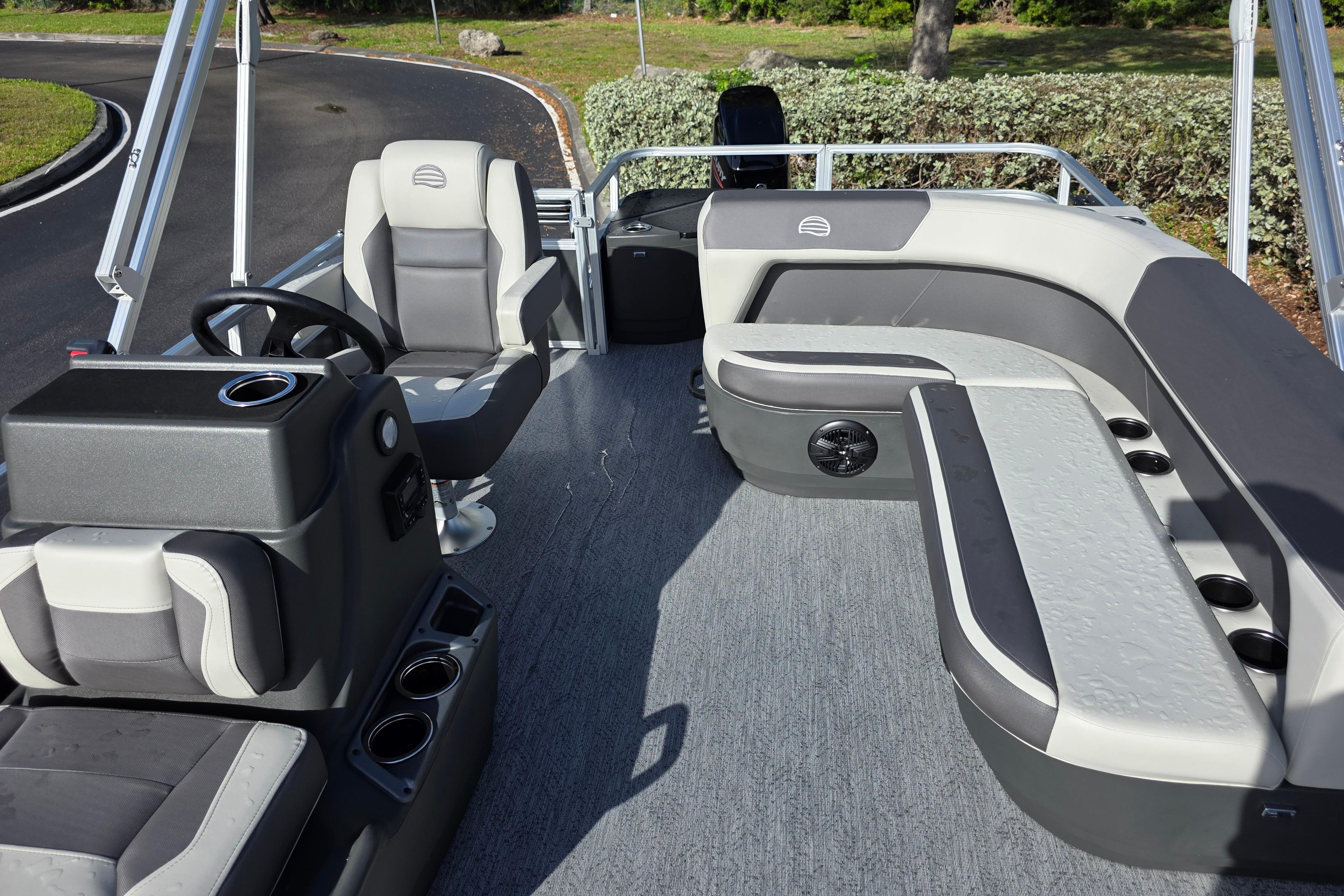 2026 Sun Tracker Bass Buggy 16 XL Select pontoon boat interior with seating and steering console.