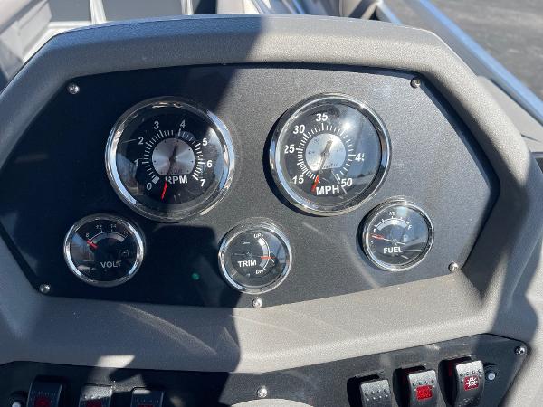 Dashboard of 2025 Armada Saphir 23CR with speedometer, RPM, volt, trim, and fuel gauges.