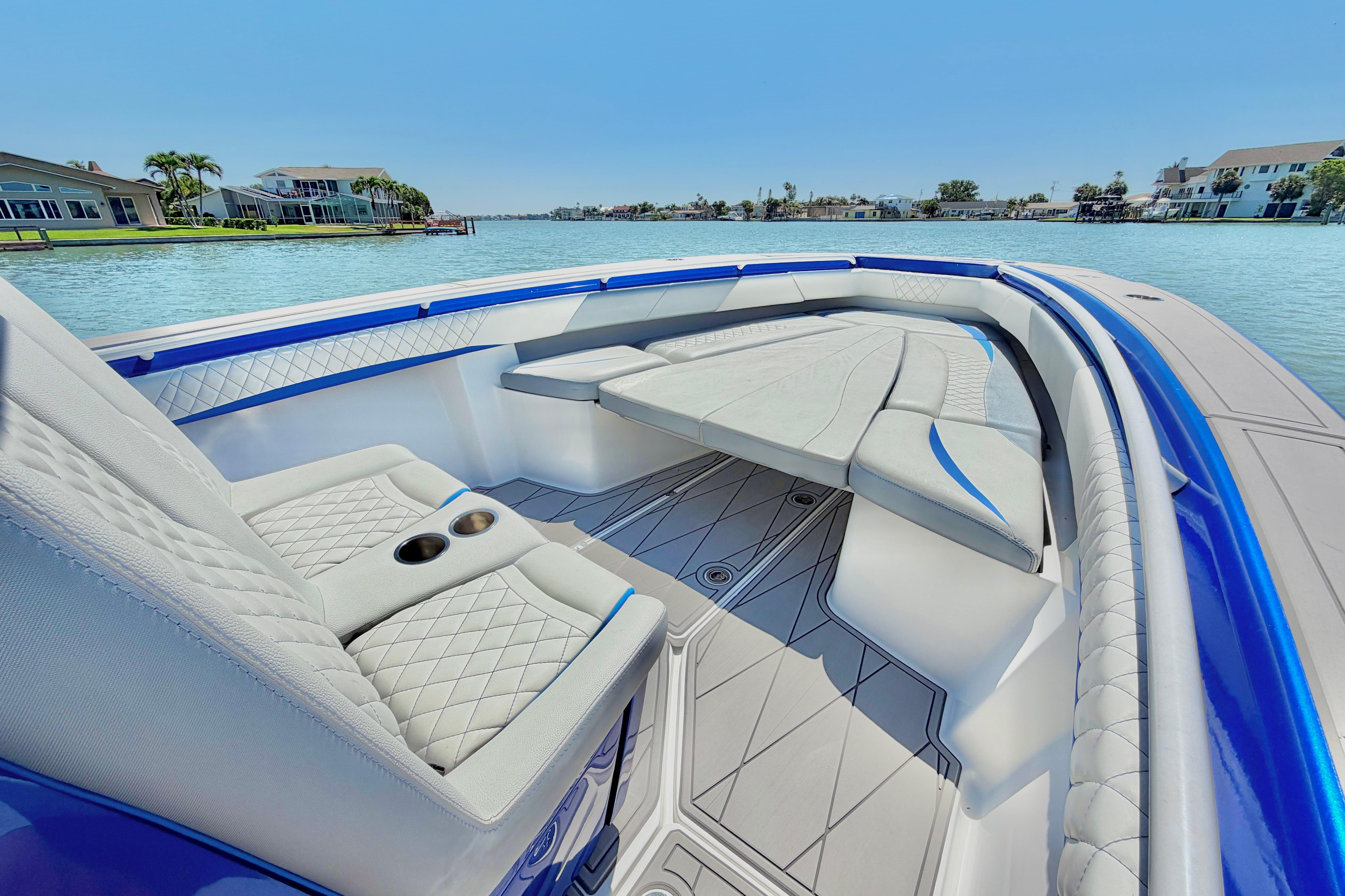 Luxurious interior of 2022 Statement 350 Open boat with elegant seating and waterfront view.