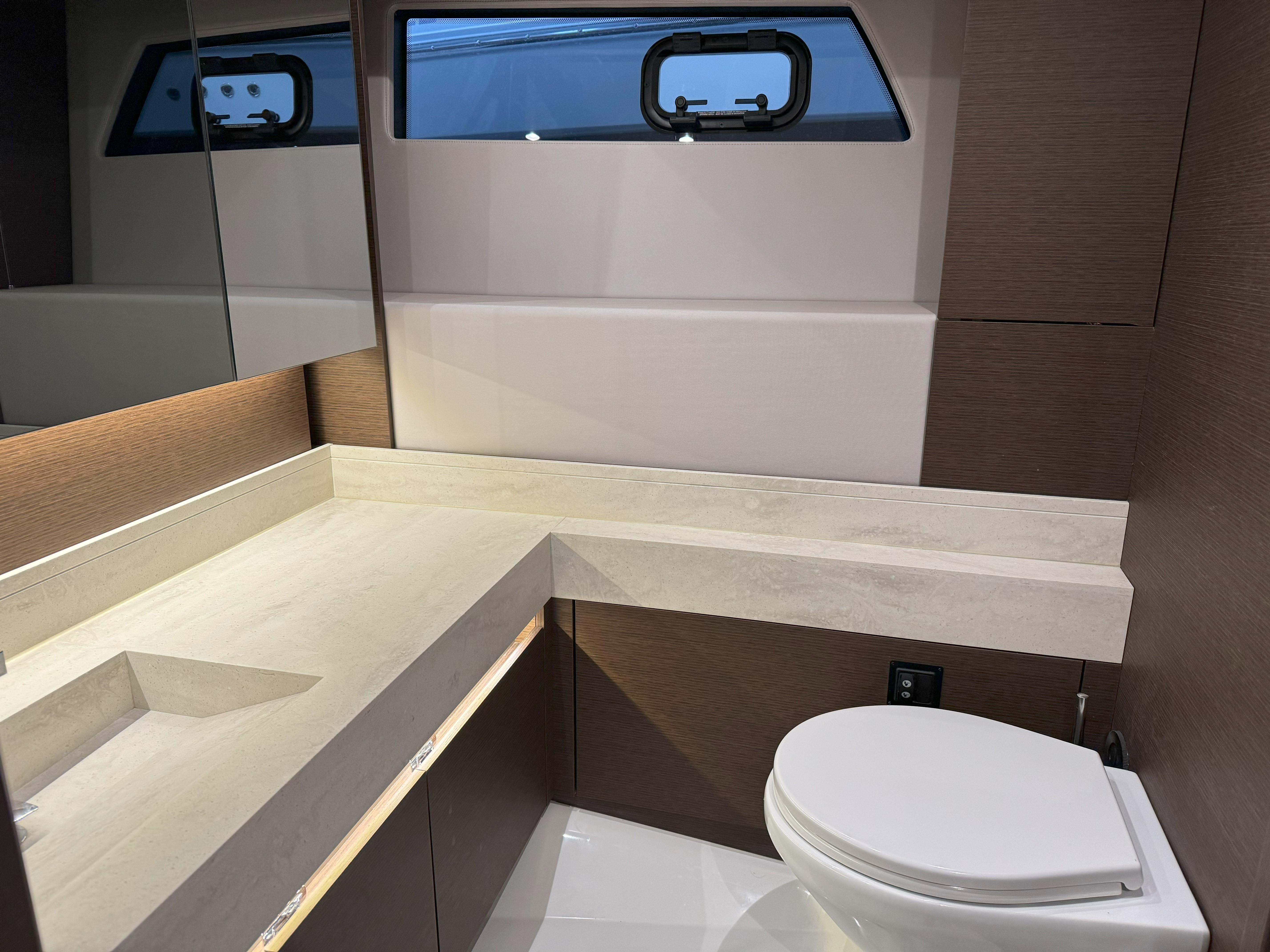 Luxurious bathroom interior of 2018 Prestige 520 Fly yacht, featuring modern design and amenities.