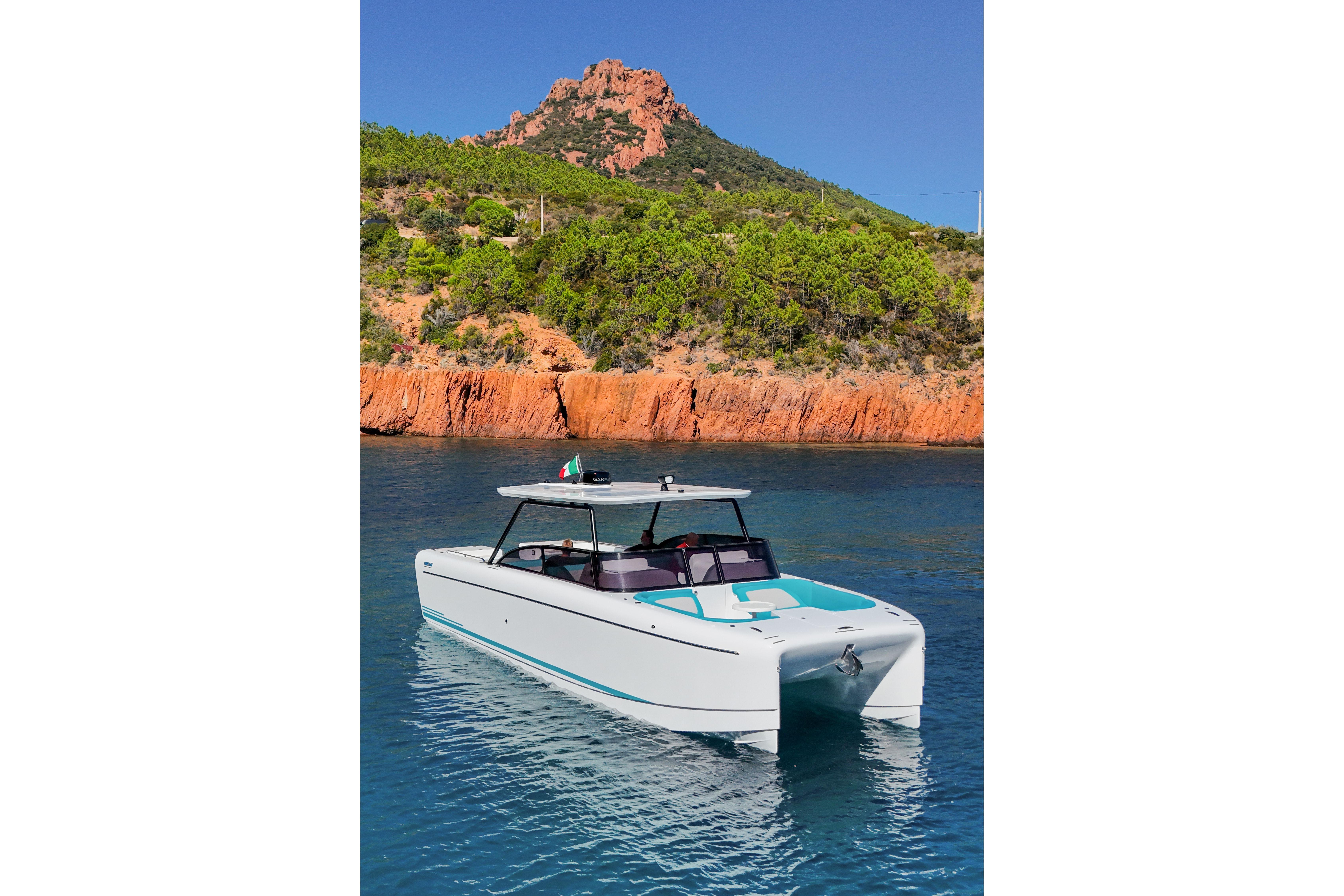 2025 Canados Heritage 36 yacht in scenic coastal waters with rocky cliffs.
