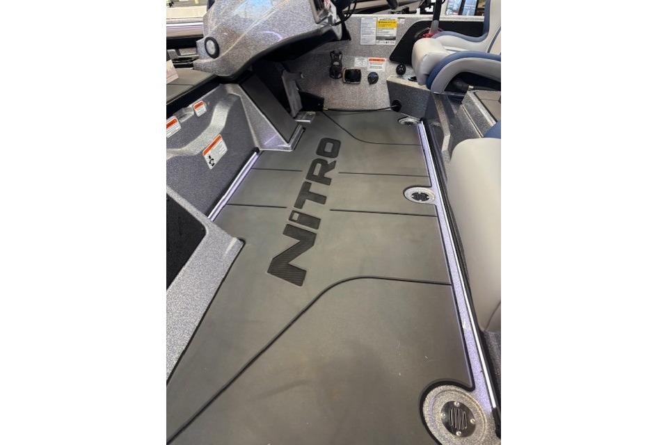 2026 Nitro Z19 XL boat interior with branded flooring and seating.