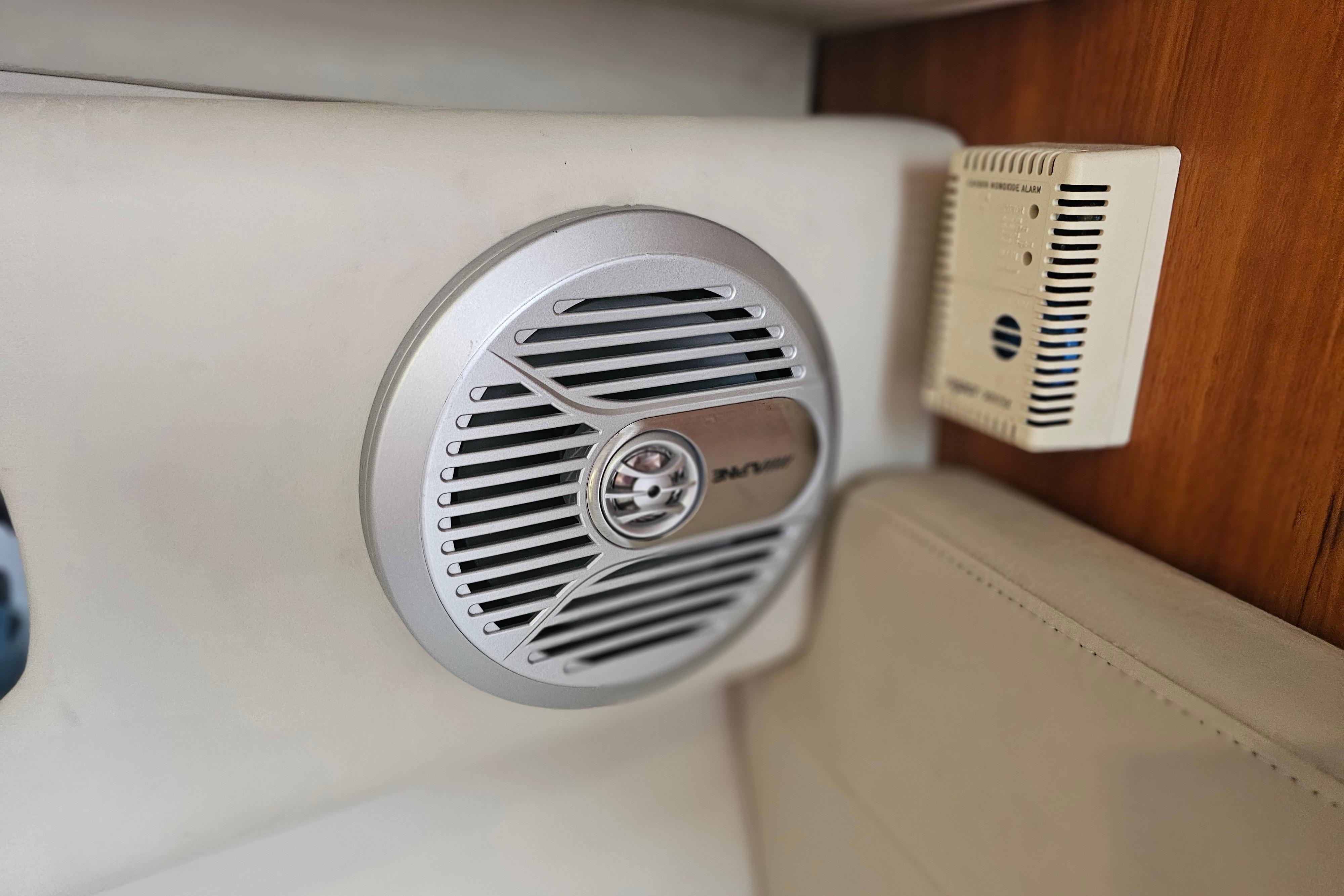 Speaker and alarm system inside 2001 Pursuit 3000 Express boat cabin.