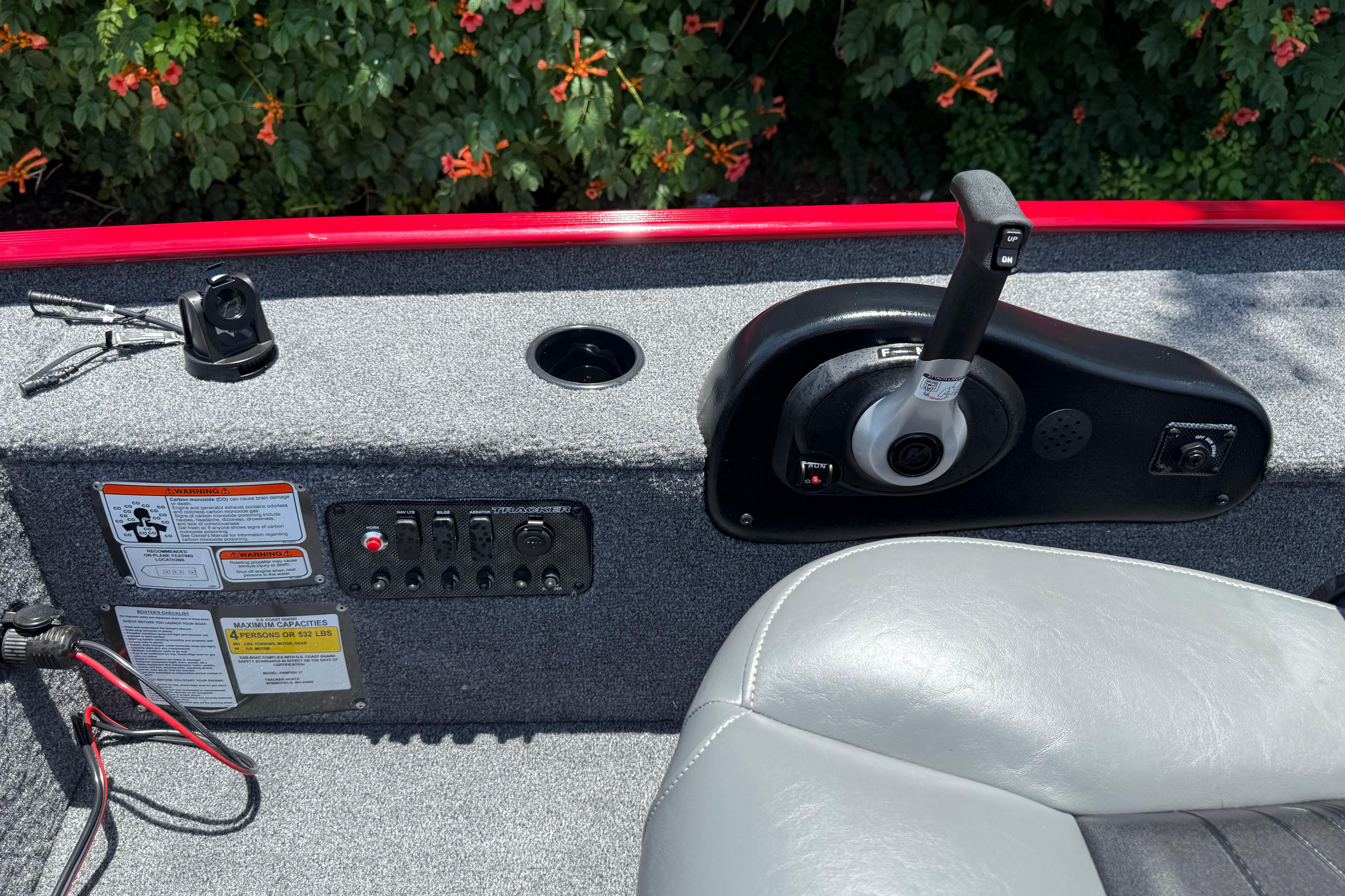 Control panel of 2025 Tracker Panfish 17 boat with throttle and switches.