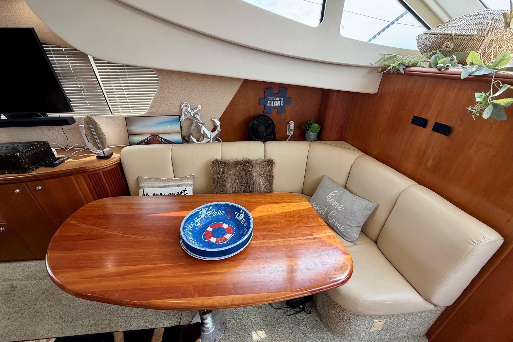 Interior of 2004 Silverton 39 Motor Yacht with cozy seating and decorative accents.