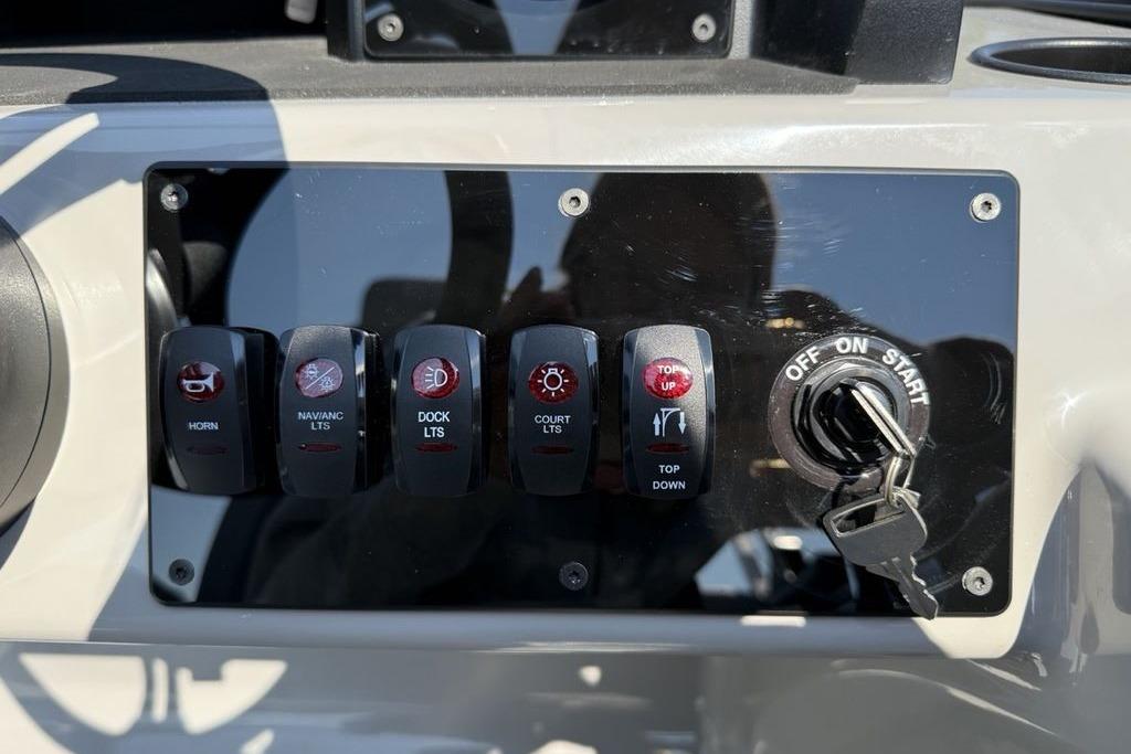 Control panel of 2026 Premier 220 Sunscape RF with switches and ignition key.