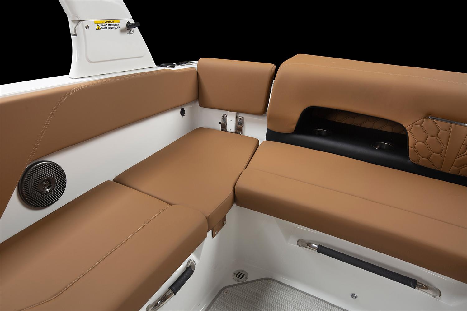 Manufacturer Provided Image: 2025 Four Winns H1 OB boat interior with brown cushioned seating.