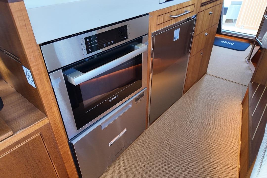 Modern kitchen in 2026 Targa 41 yacht with Bosch appliances and sleek cabinetry.